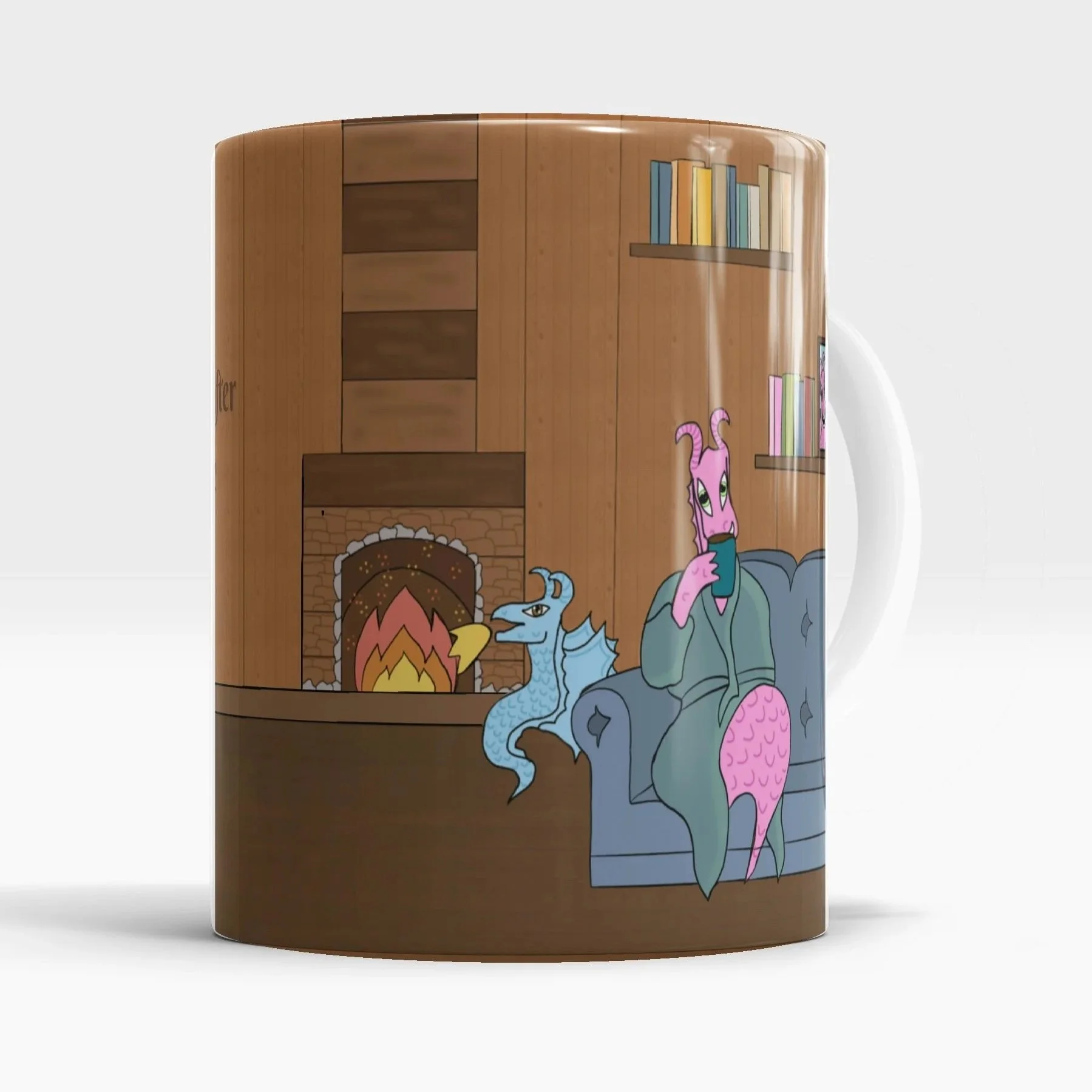 A mug featuring cartoon illustrations of a pink dragon, a blue dragon, and an anthropomorphic pink creature with a scaly tail sitting on a gray couch in front of a wooden wall with a brick fireplace and a bookshelf.