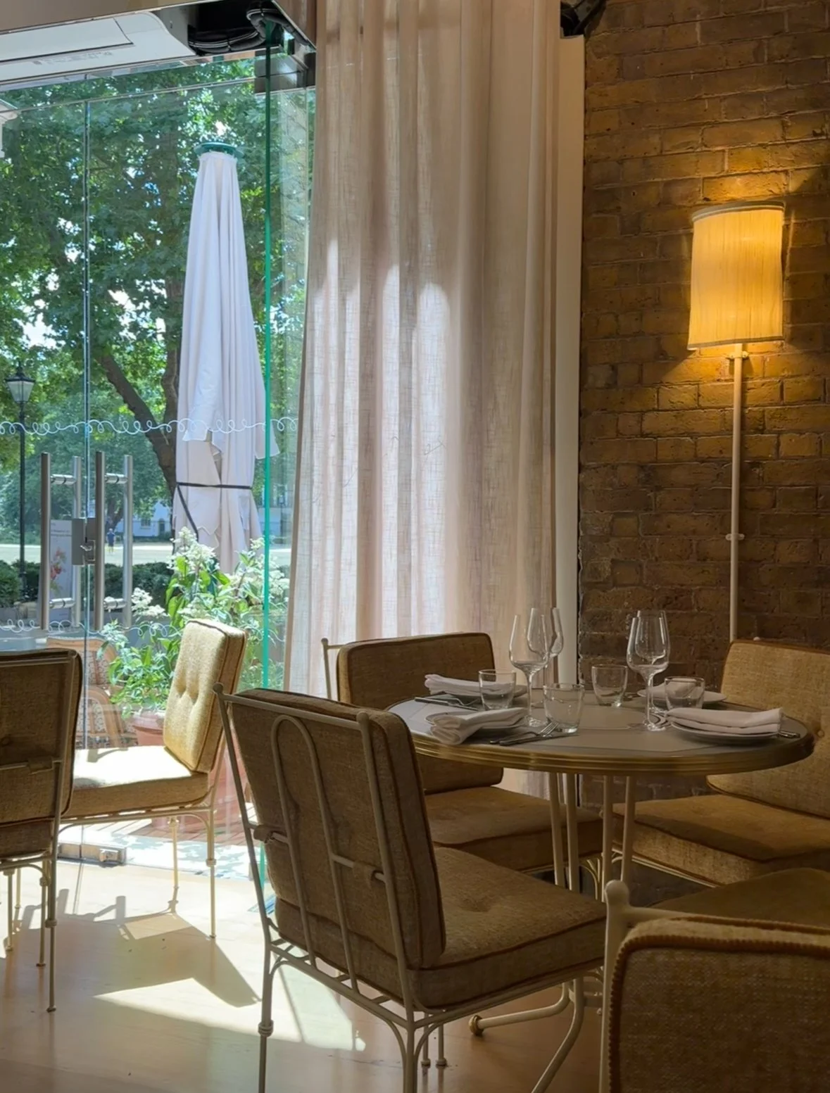 Elegant interior at Cafe Linea, with comfortable lounge chairs and plenty of natural light.