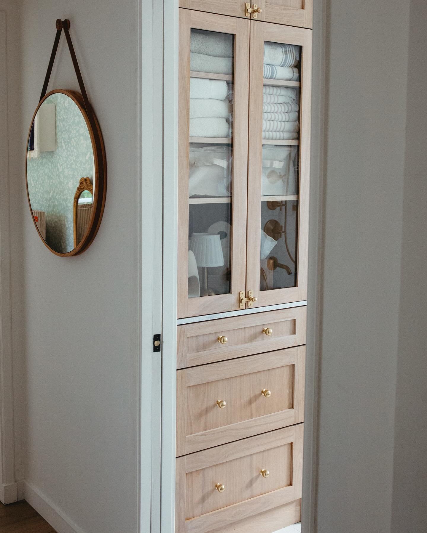 Love me a built-in 👌🏻 swipe for the before 👉🏻

This used to be a deep linen closet accessed only from the hallway. By opening the wall and switching access to the interior of this petite hallway bath, plus adding a pocket door, not only improved 