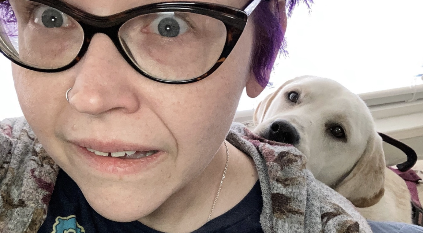Picture of a white person and yellow dog