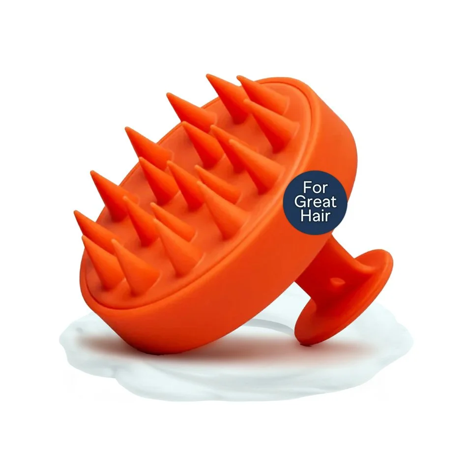 Orange silicone scalp massager with pointed bristles, labeled 'For Great Hair'.