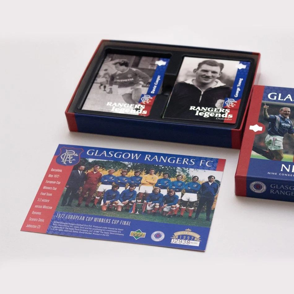Box of Glasgow Rangers FC playing cards and commemorative postcard, featuring images of legendary players and details of the 1972 European Cup Winners Cup final.