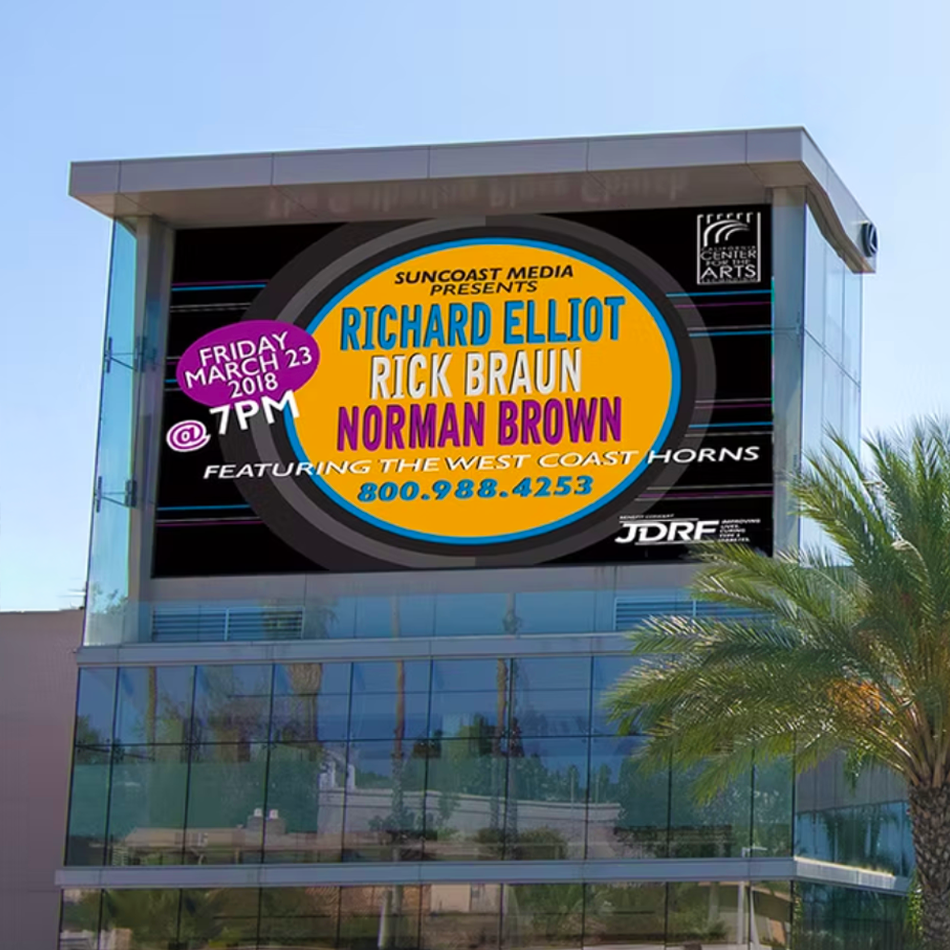 Billboard announcing a concert featuring Richard Elliot, Rick Braun, and Norman Brown on March 23, 2018 at 7 PM at a venue associated with Suncoast Media. It mentions the West Coast Horns and includes a phone number, 800.988.4253, with a JDRF logo at the bottom right. The billboard is mounted on a modern glass building with palm trees.