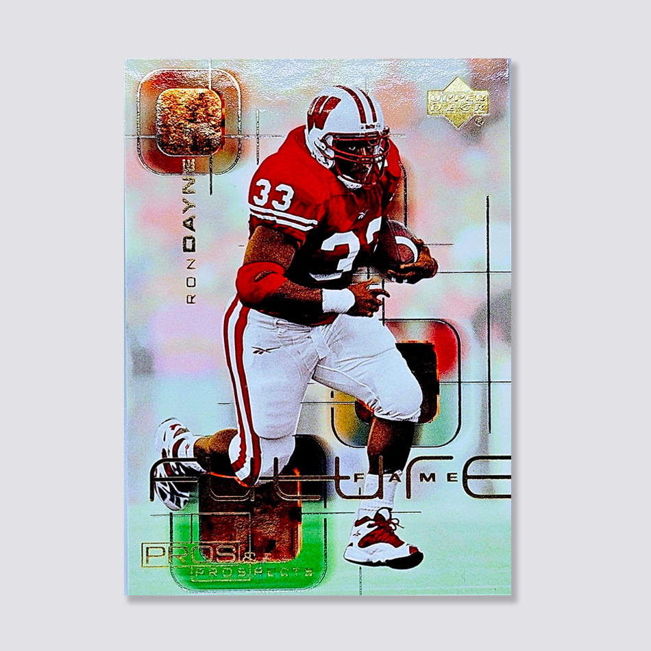 Football trading card featuring a player in a red and white uniform, labeled "Ron Dayne." The card has holographic elements and texts including "future fame" and "pros and prospects."