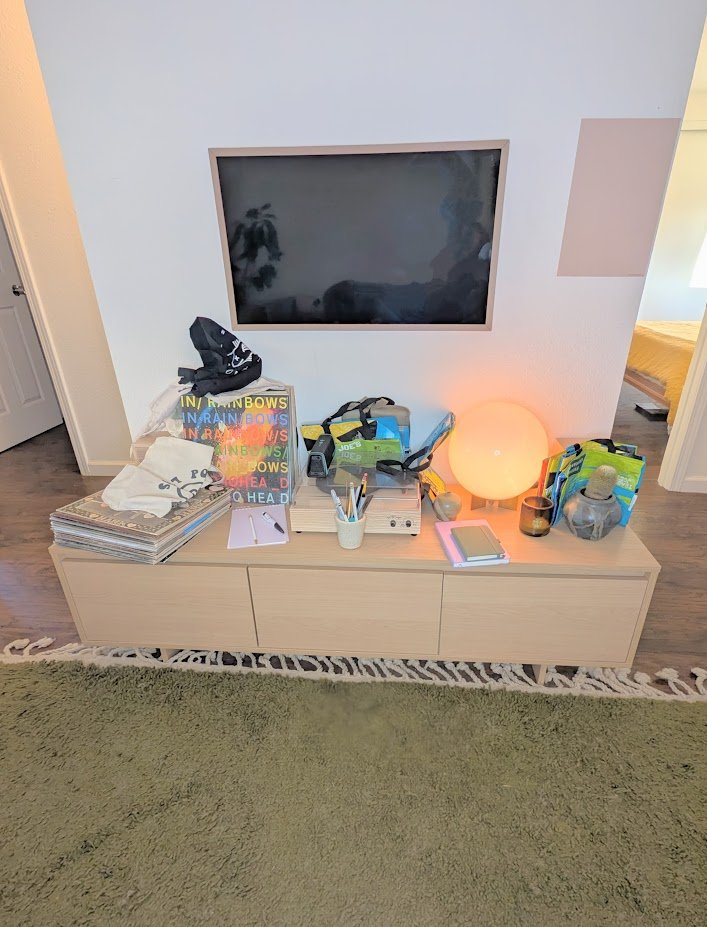 Oceanside California home organizer before and after gallery showcasing cluttered messy unorganized entertainment center family room living room