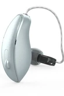 Silver modern hearing aid with a small button and clear wire.