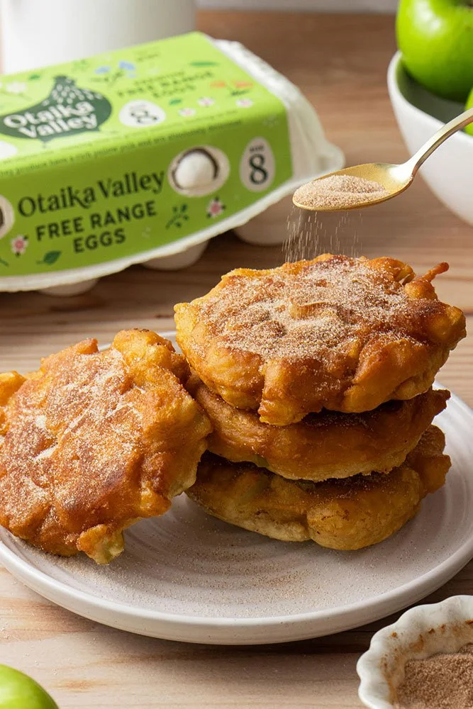 Warm, crispy, golden apple fritters with cinnamon sugar sprinkled on top