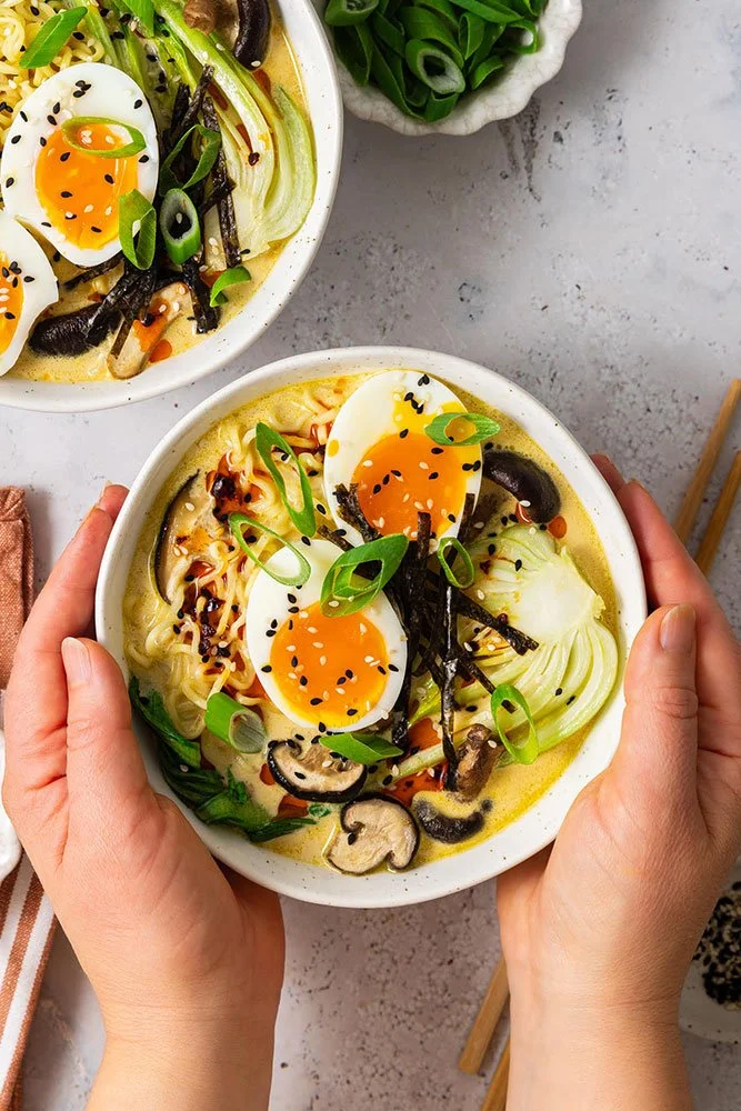 Ramen served with jammy eggs, bok choy and shiitake mushrooms