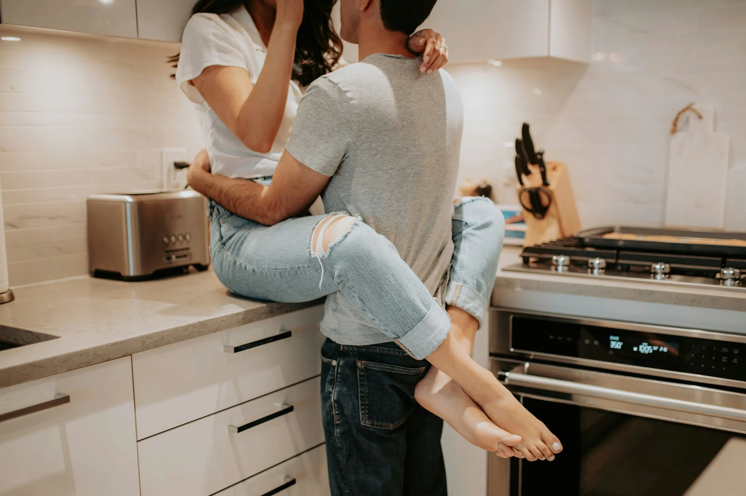 man and woman in kitchen