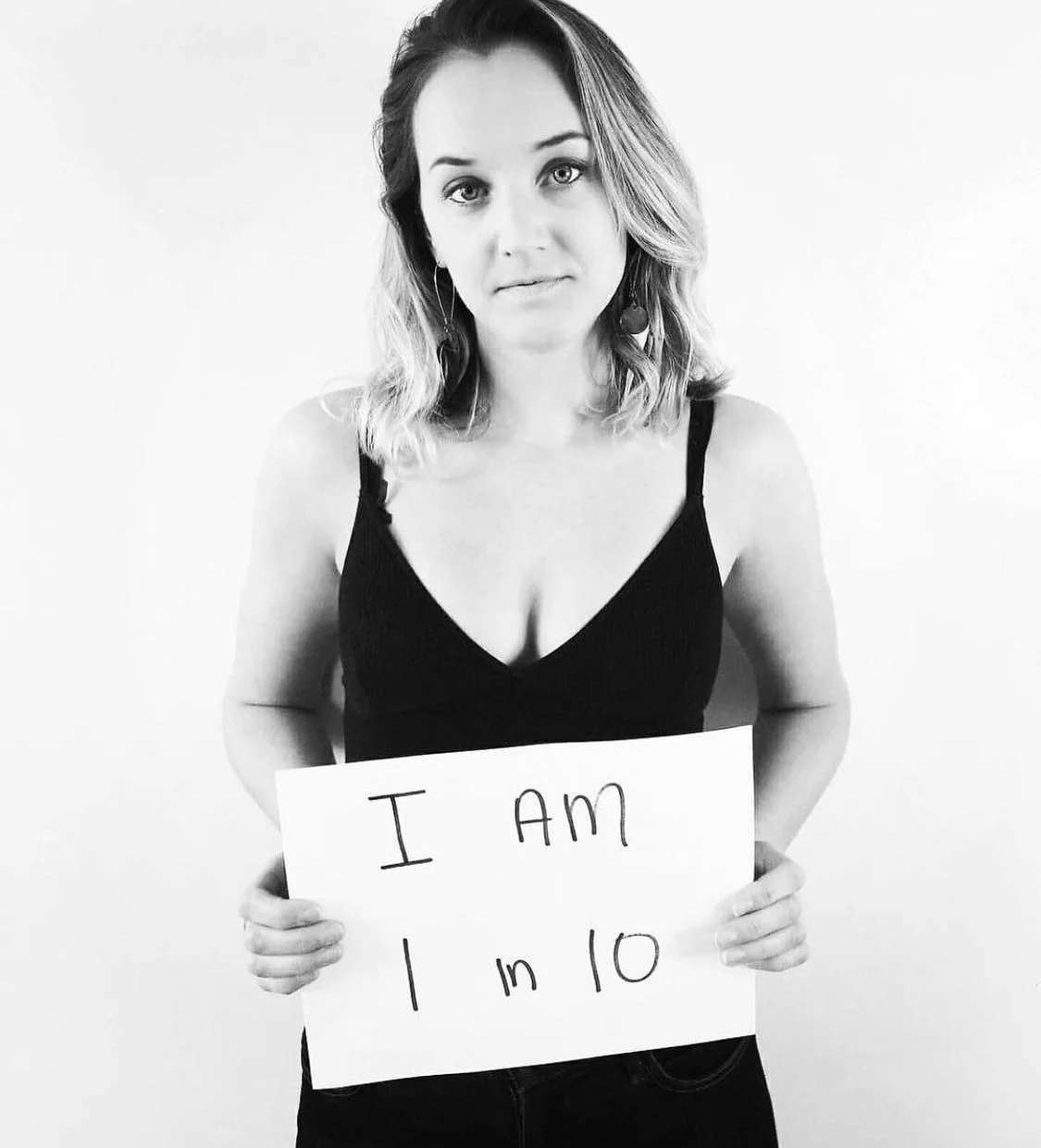 Robyn Kelly honoring her healing journey after miscarriage, advocating for women’s reproductive health and emotional wellbeing.