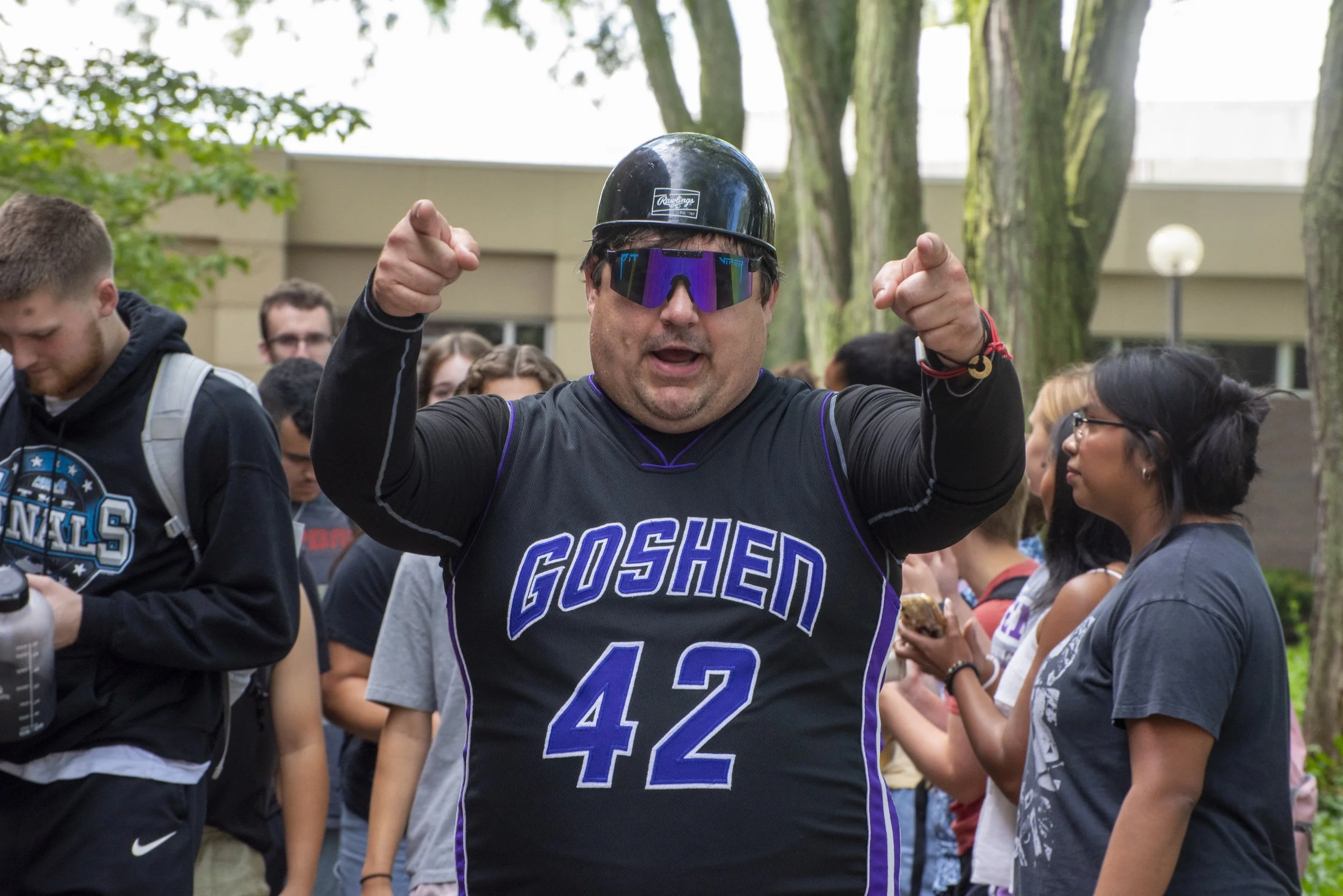 Jason Samuel, Director of Globe Media, directs traffic during GC's applause tunnel on Wednesday.