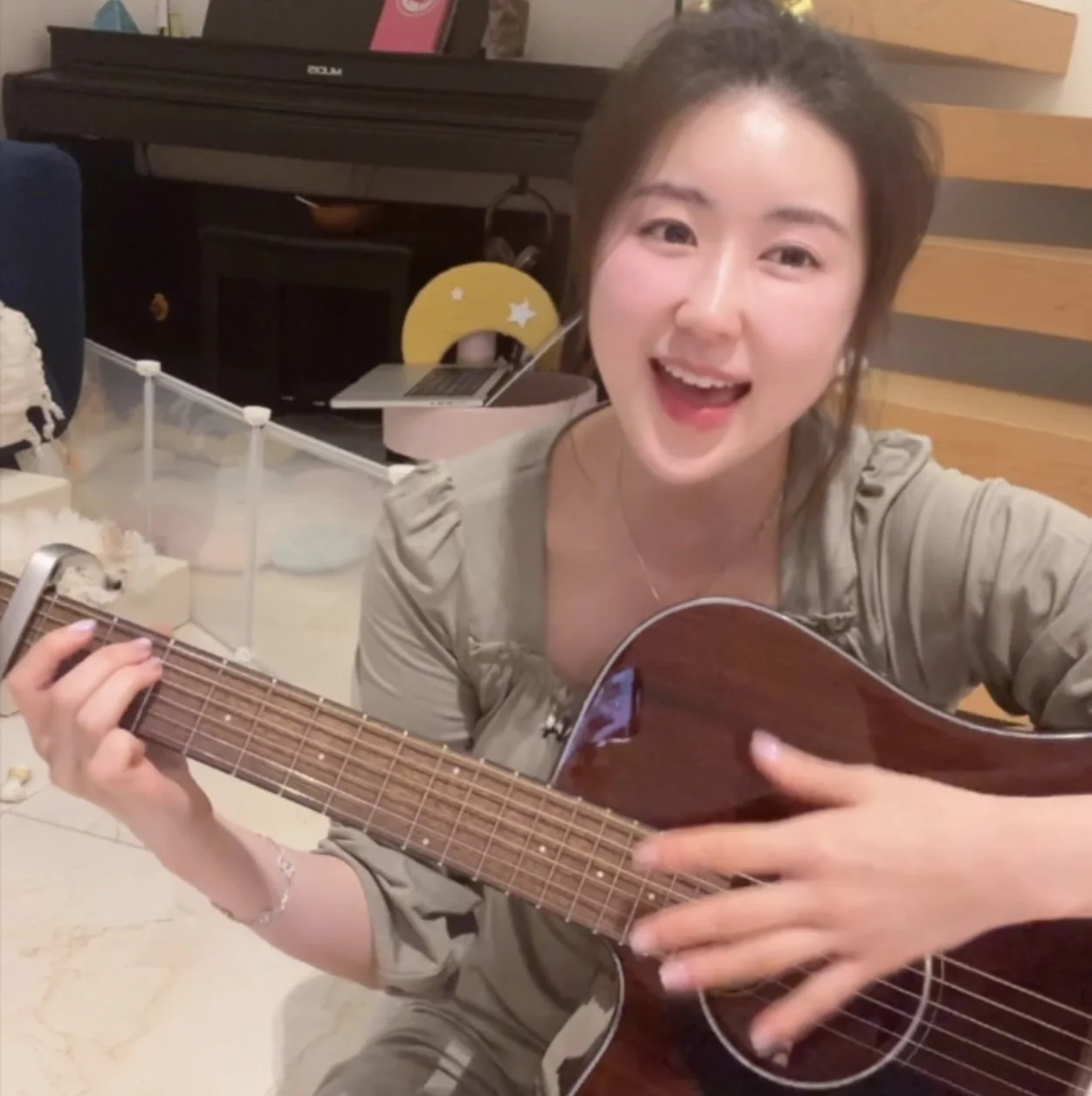 Sohyun playing guitar