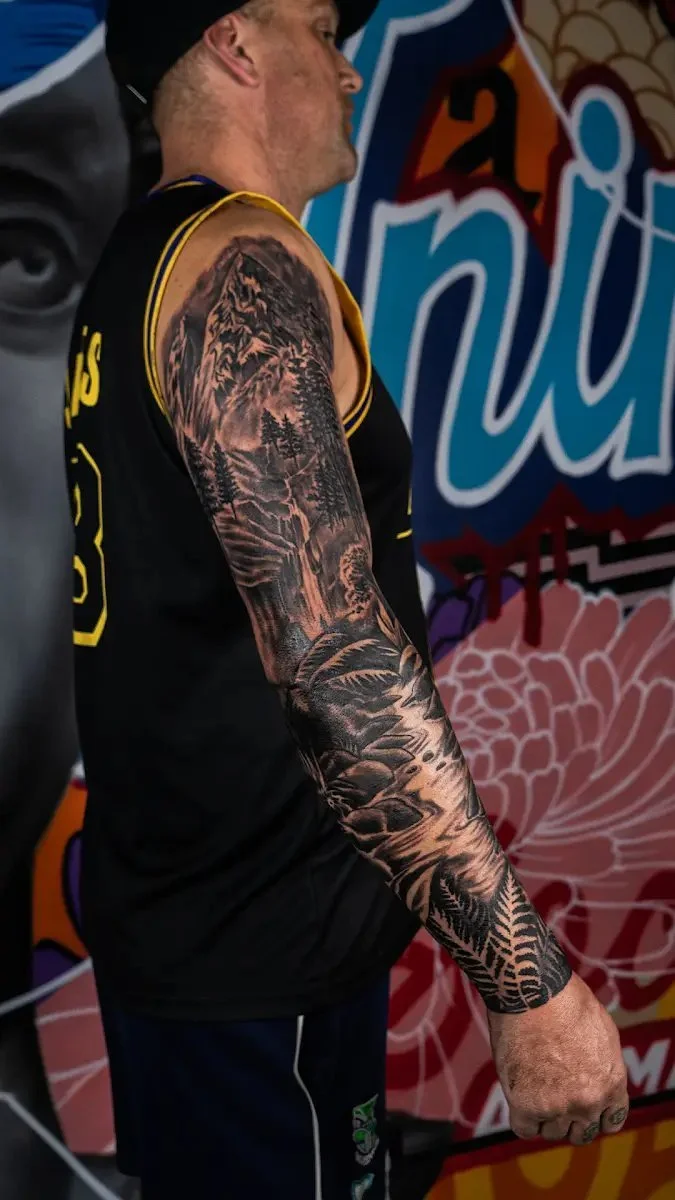 Social Animals tattoo β black and grey sleeve