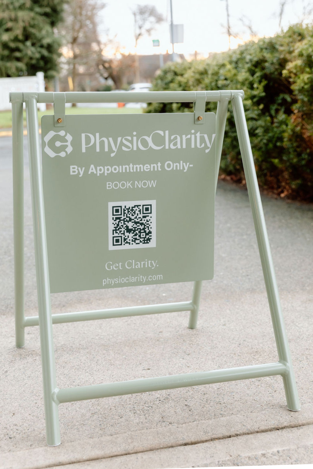 PhysioClarity sidewalk street sign