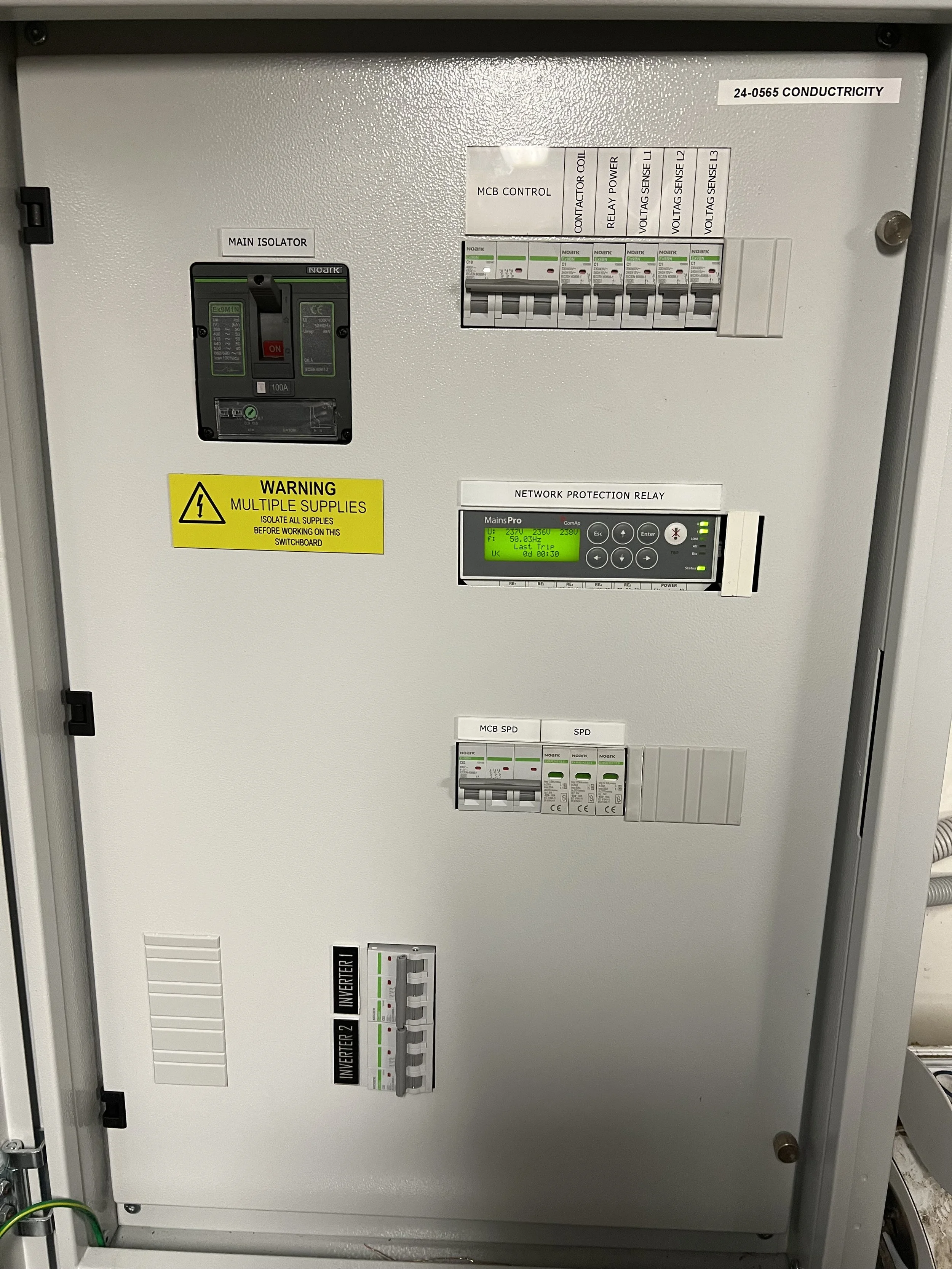Electrical switchboard with main isolator, MCB controls, and network protection relay.