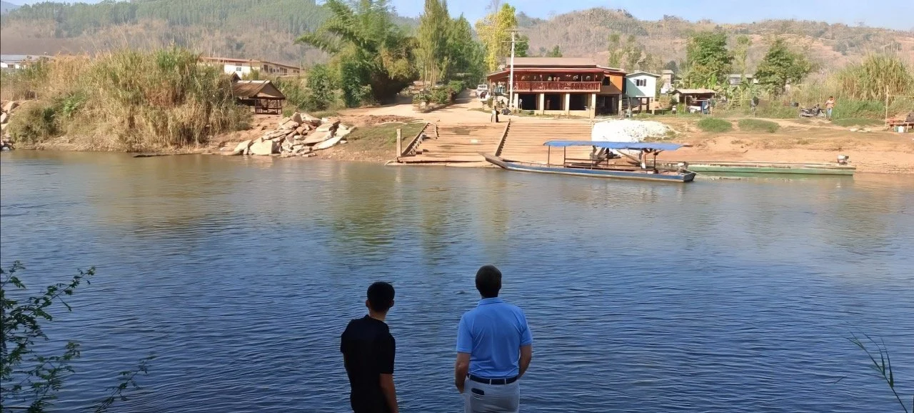 Tim and Newton looking across river to Myanmar+ Large.jpeg