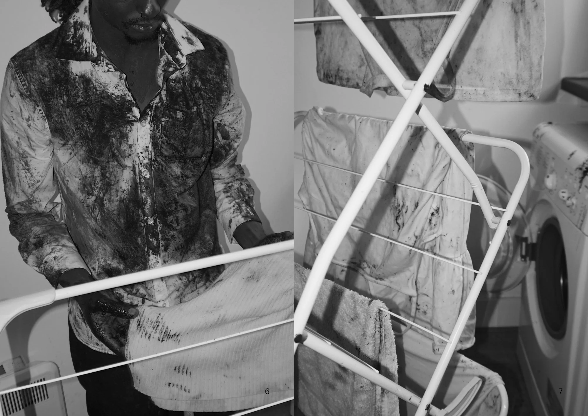 A person wearing a paint-splattered shirt standing at a laundry drying rack with dirty clothes. The laundry rack is made of white metal and has several clothes holding bars. In the background, a washing machine is partially visible.