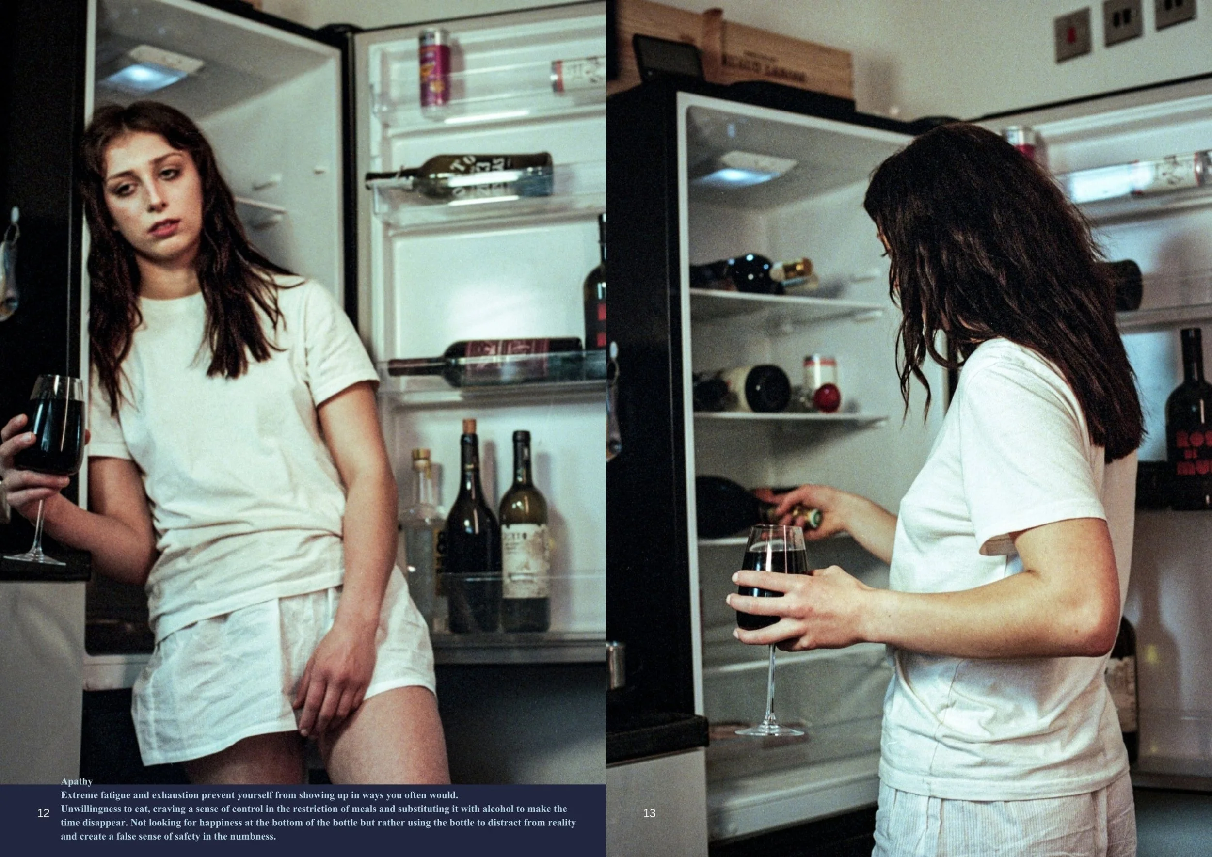 A woman with shoulder-length dark hair in a white t-shirt and shorts sitting in front of an open refrigerator, holding a glass of red wine. The fridge is partially open, with bottles and cans inside. The scene appears to be in a kitchen, with the wom