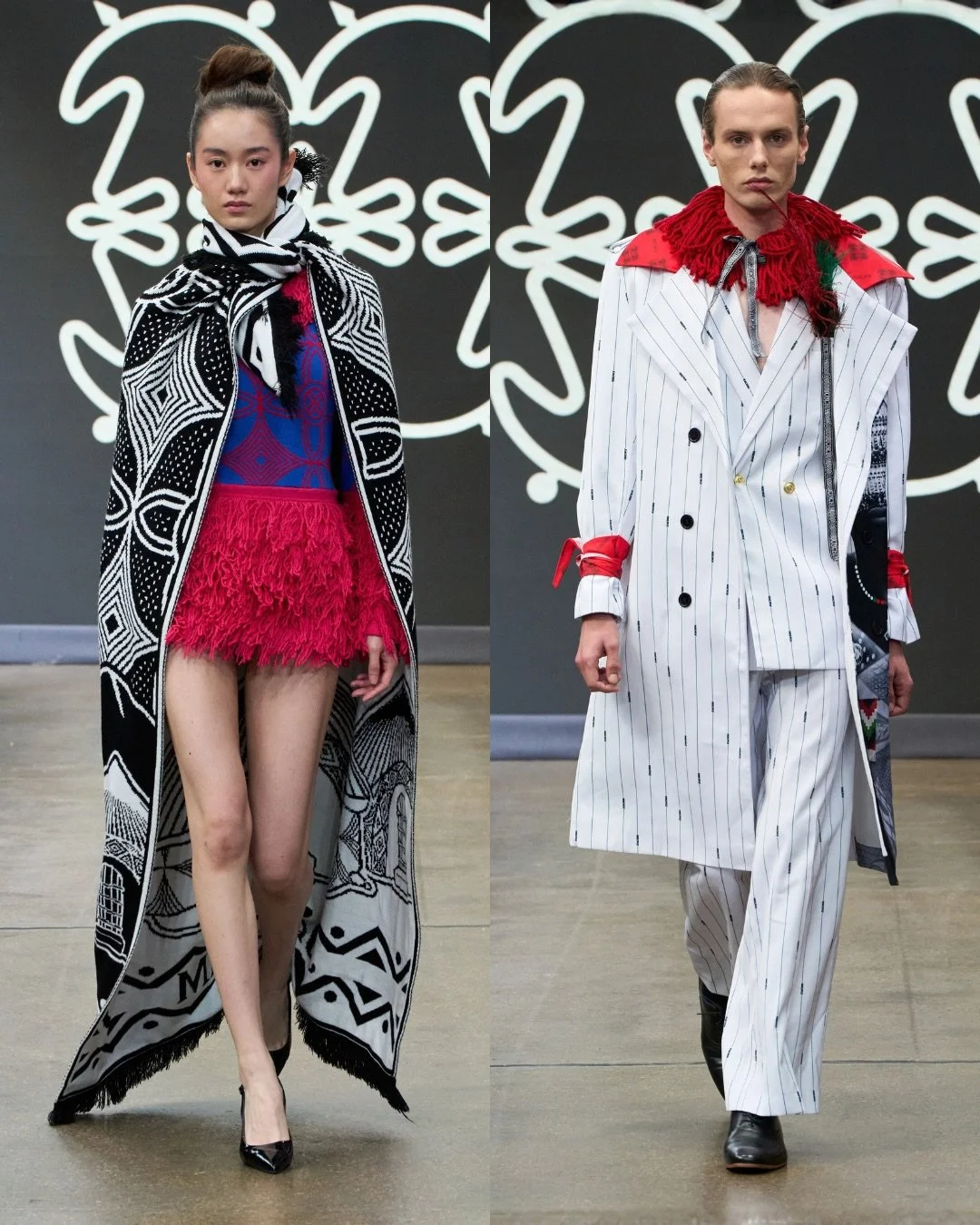 Two models walking on runway at fashion show, one female and one male, with black and white abstract background.