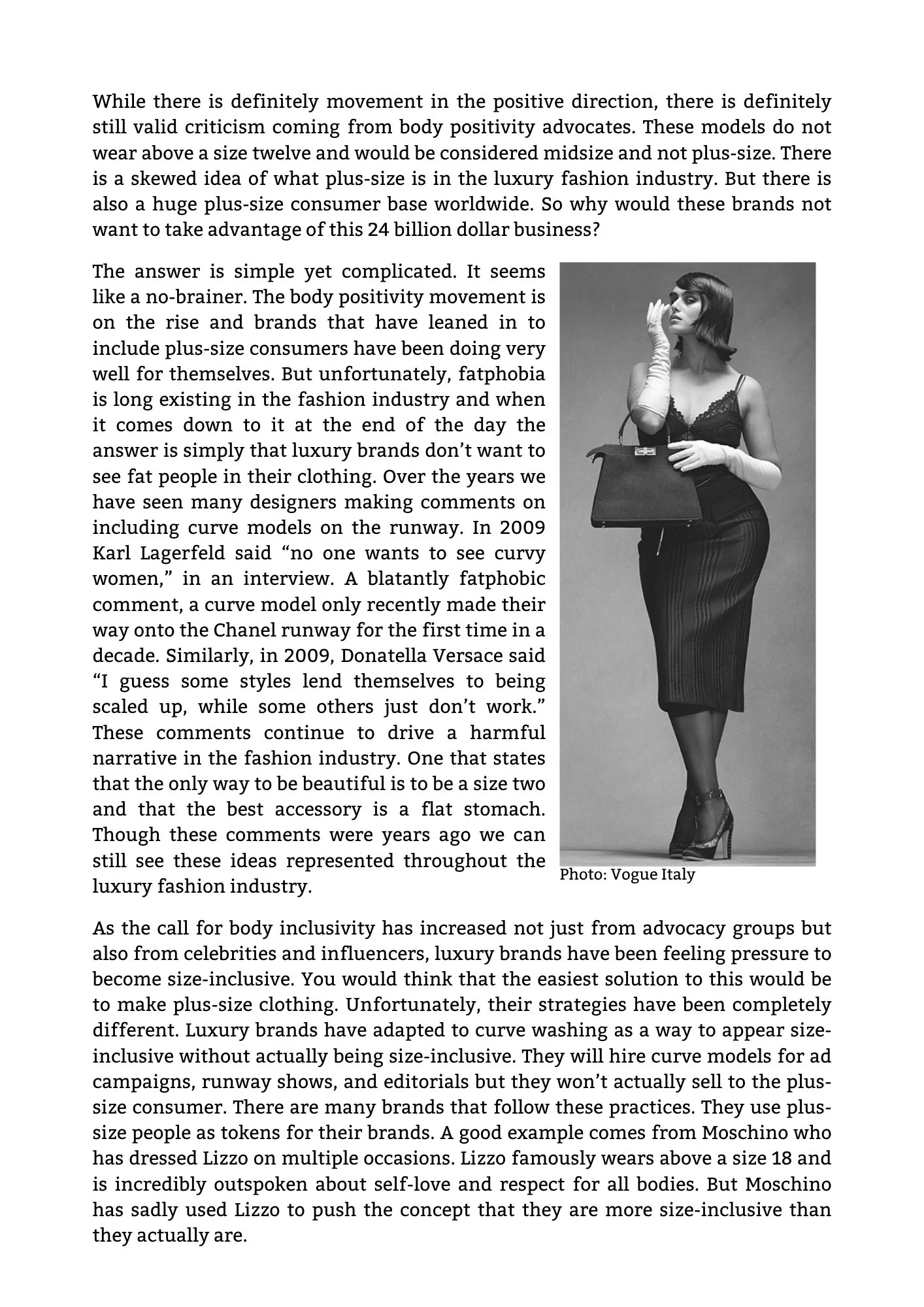 Black-and-white photo of a woman wearing a fitted dress, high heels, and long gloves, holding a handbag, posed with her hand near her face. Photo credited to Vogue Italy.