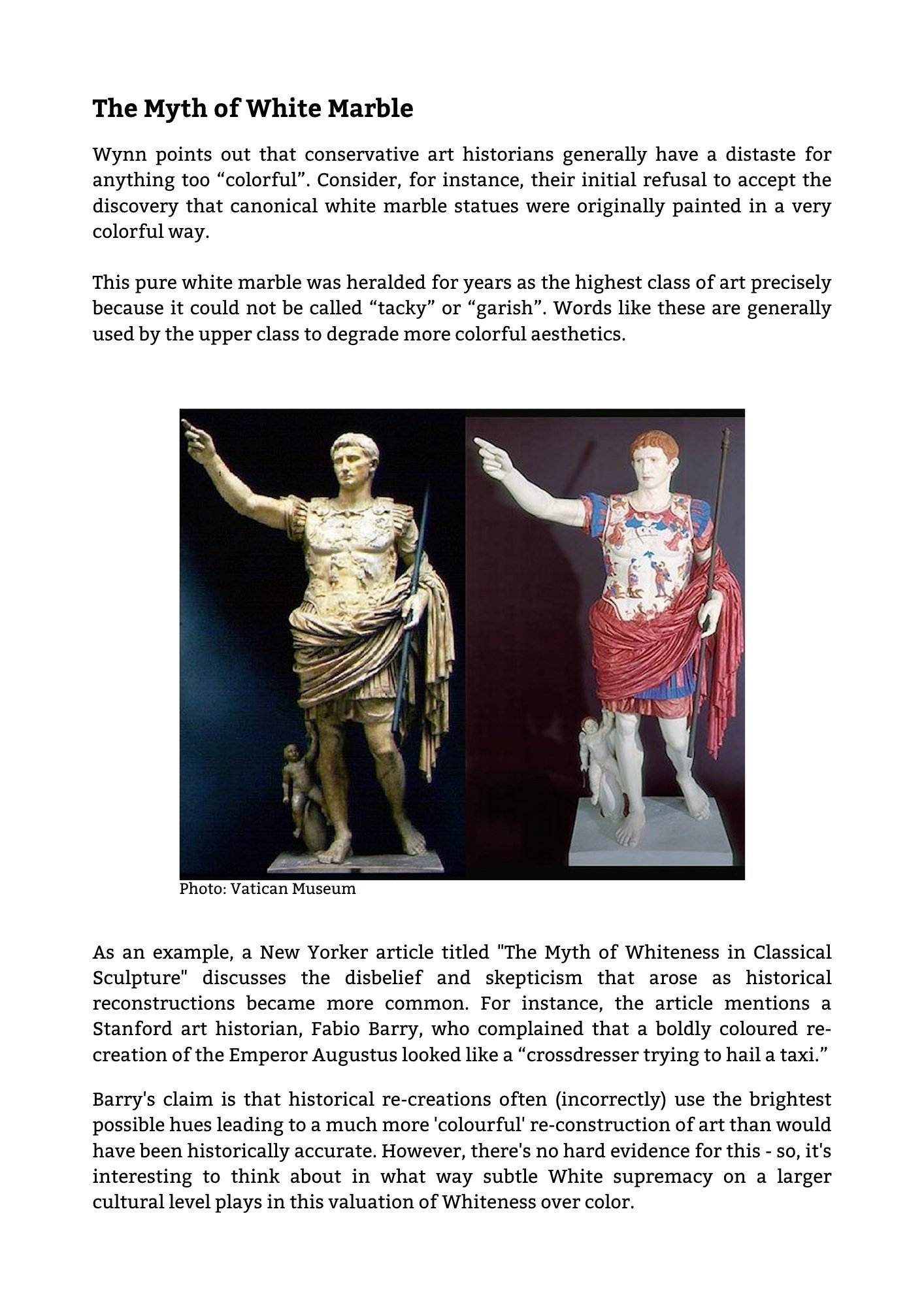 Two statues of Roman emperors, one with a golden hue and the other with colorful clothing, both in classic Roman attire with one holding a staff and the other pointing forward.