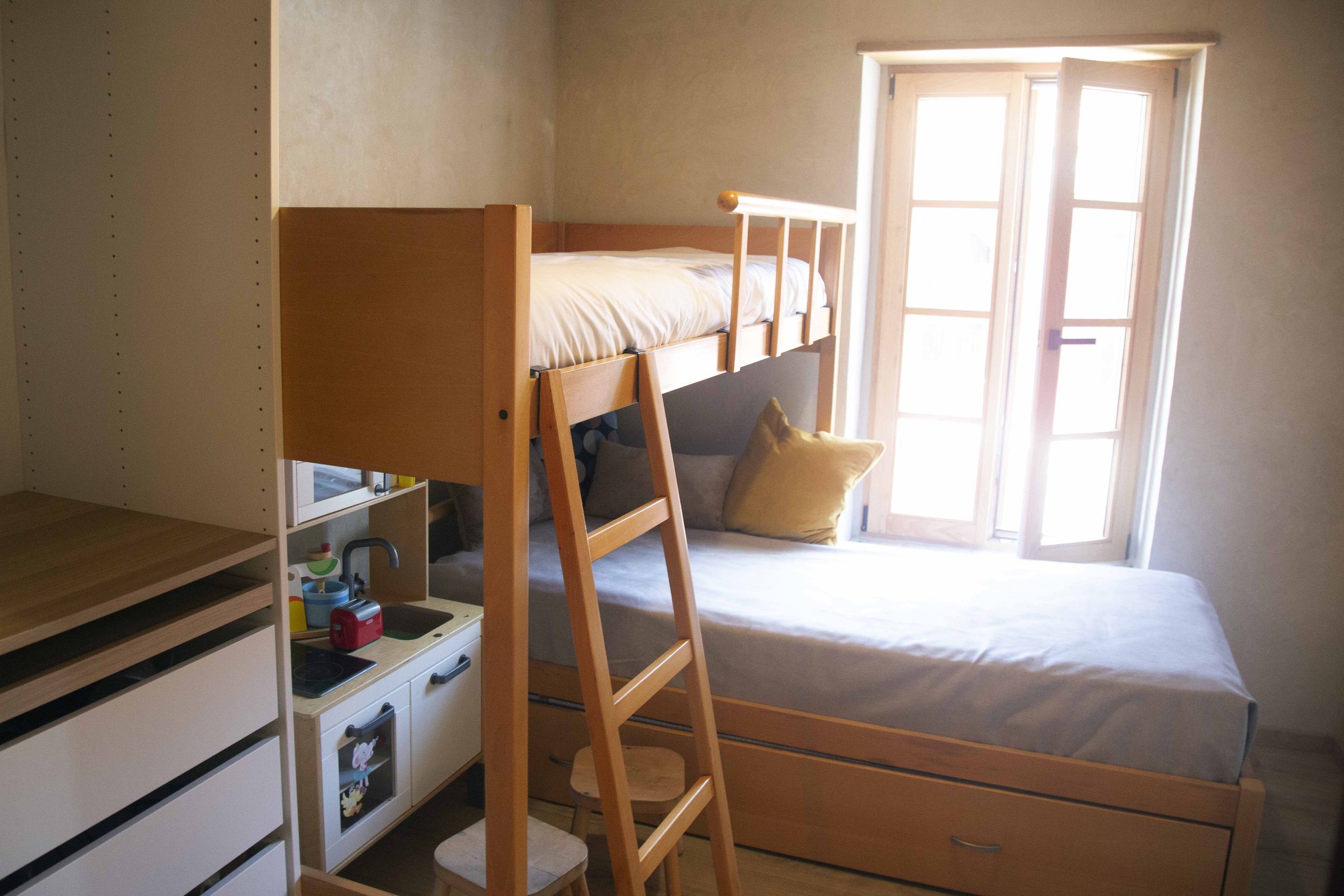 Kids Room Side View with Wooden Castana Window