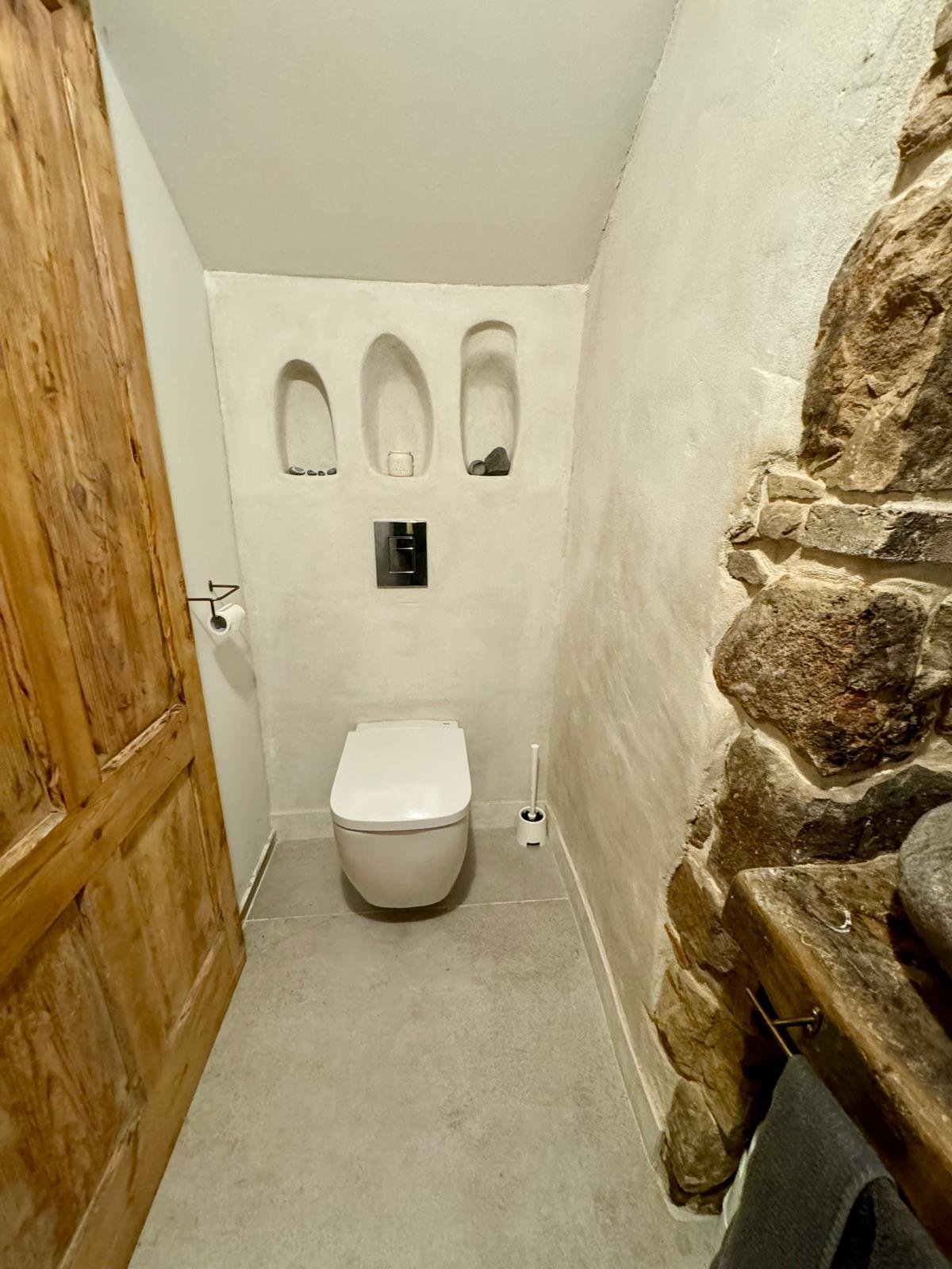 Floating Toilet with Hand-Carved Asymmetrical Nooks