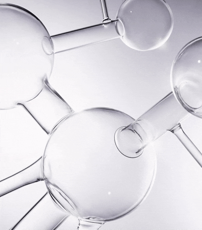 Close-up of several interconnected glass test tubes and bottles.