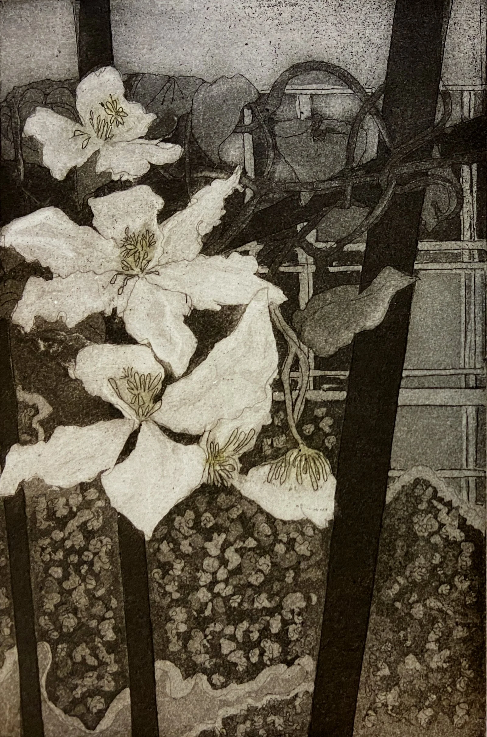 White flowers around black strips edging and an window at the back