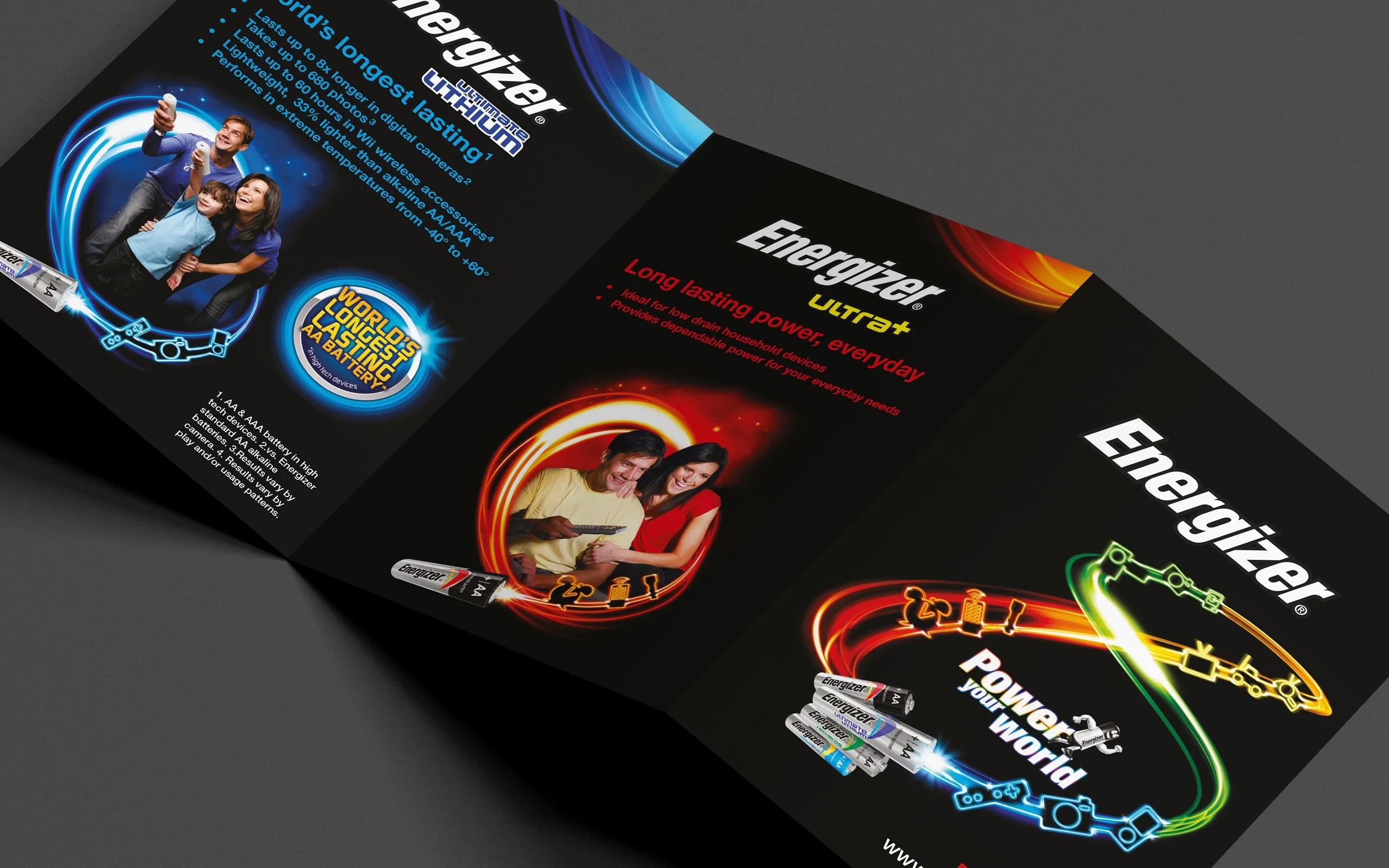 Branded brochure for Energizer batteries featuring images of happy children and adults, with colorful neon outlines of batteries and electrical sparks, showcasing product features and branding.