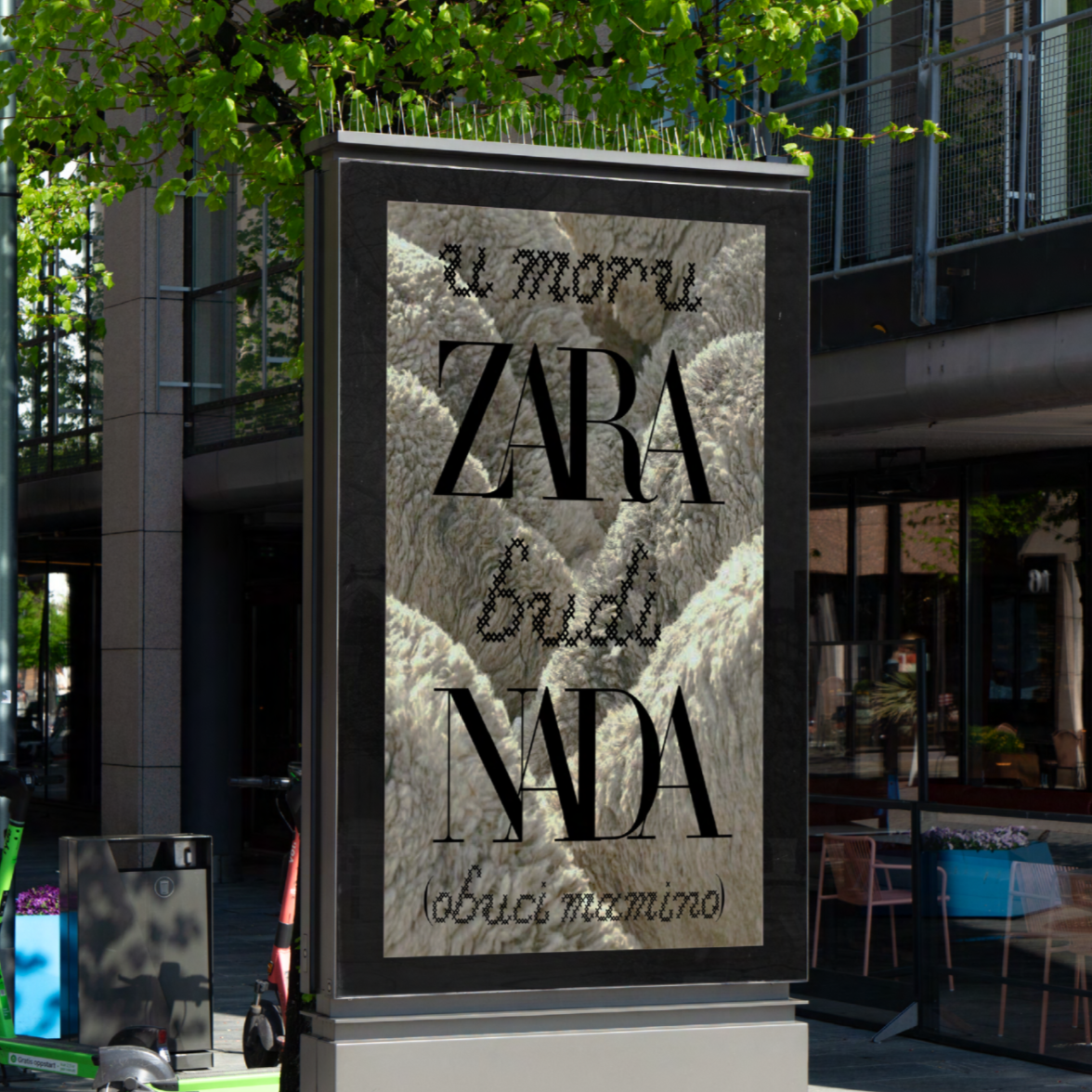 Advertising display on a city sidewalk with the text 'Zara' and other words in stylish fonts, featuring a background of textured fabric or material.