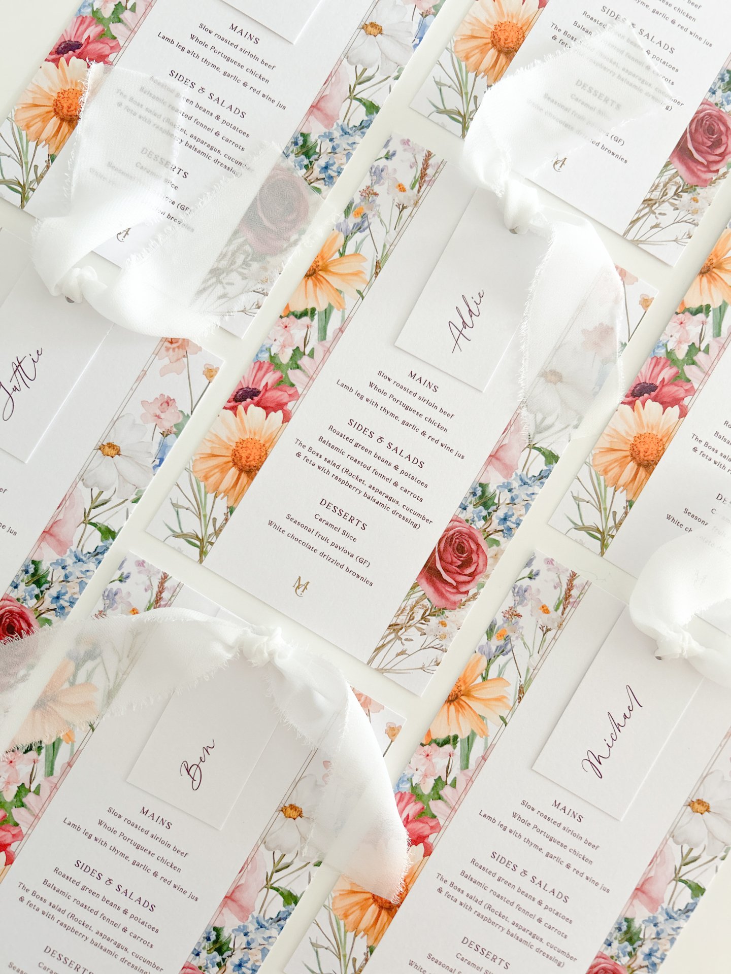 Soft silk, scattered wildflowers, and the sweetest celebration 🤍

Madee &amp; Charlie&rsquo;s custom menus and place cards were designed to echo the feeling of a garden in full bloom &mdash; personal, poetic, and perfectly them.

Tied with love (and