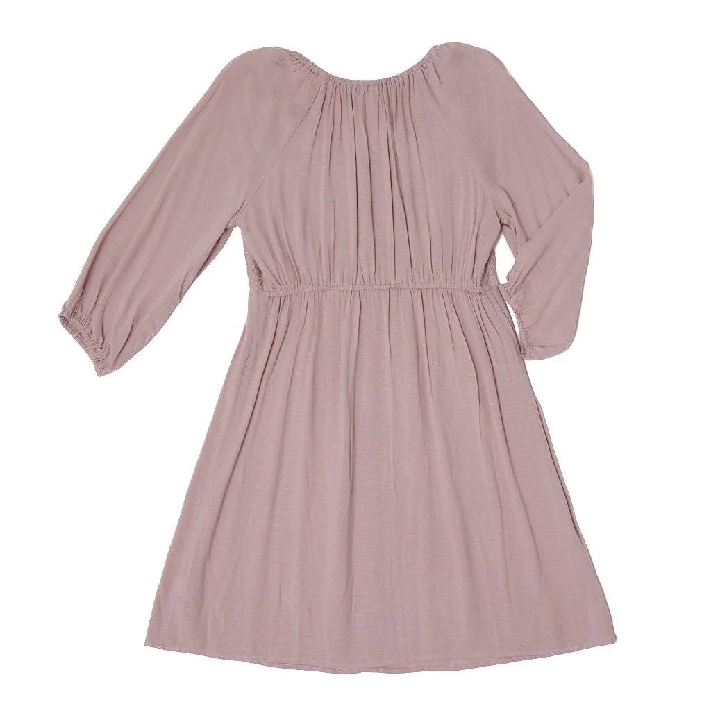 Light pink long-sleeve dress with a gathered waist and pleated skirt.