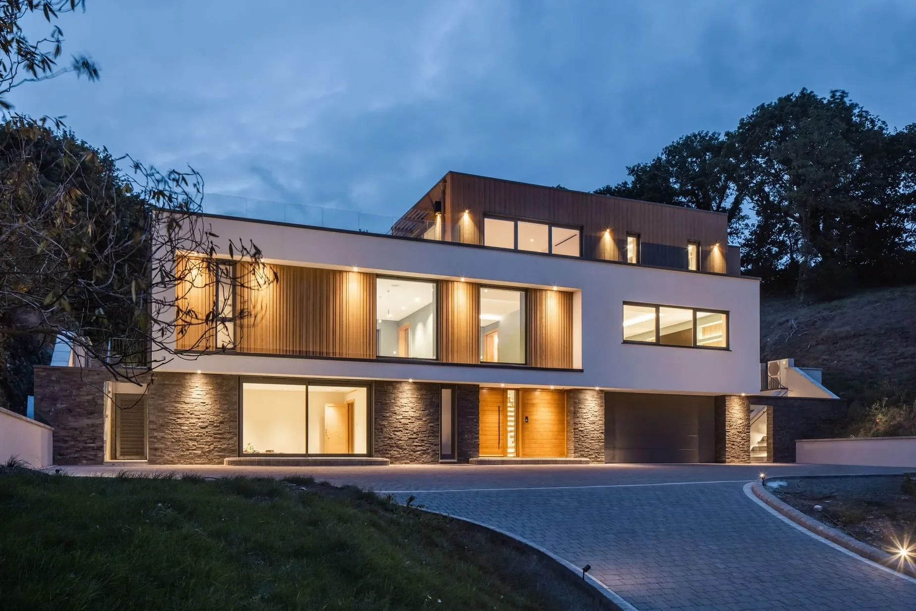 image of the front of the jersey villa for sale at night