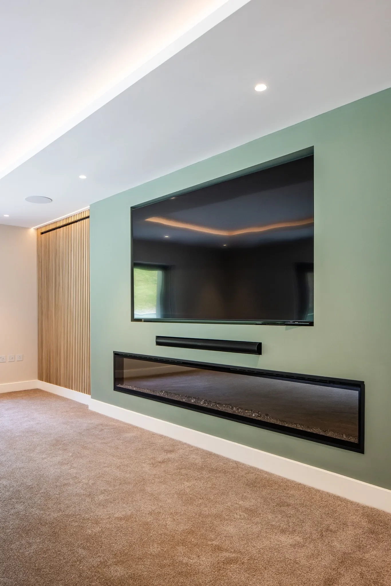 image of the built in media system in the modern Jersey villa for sale
