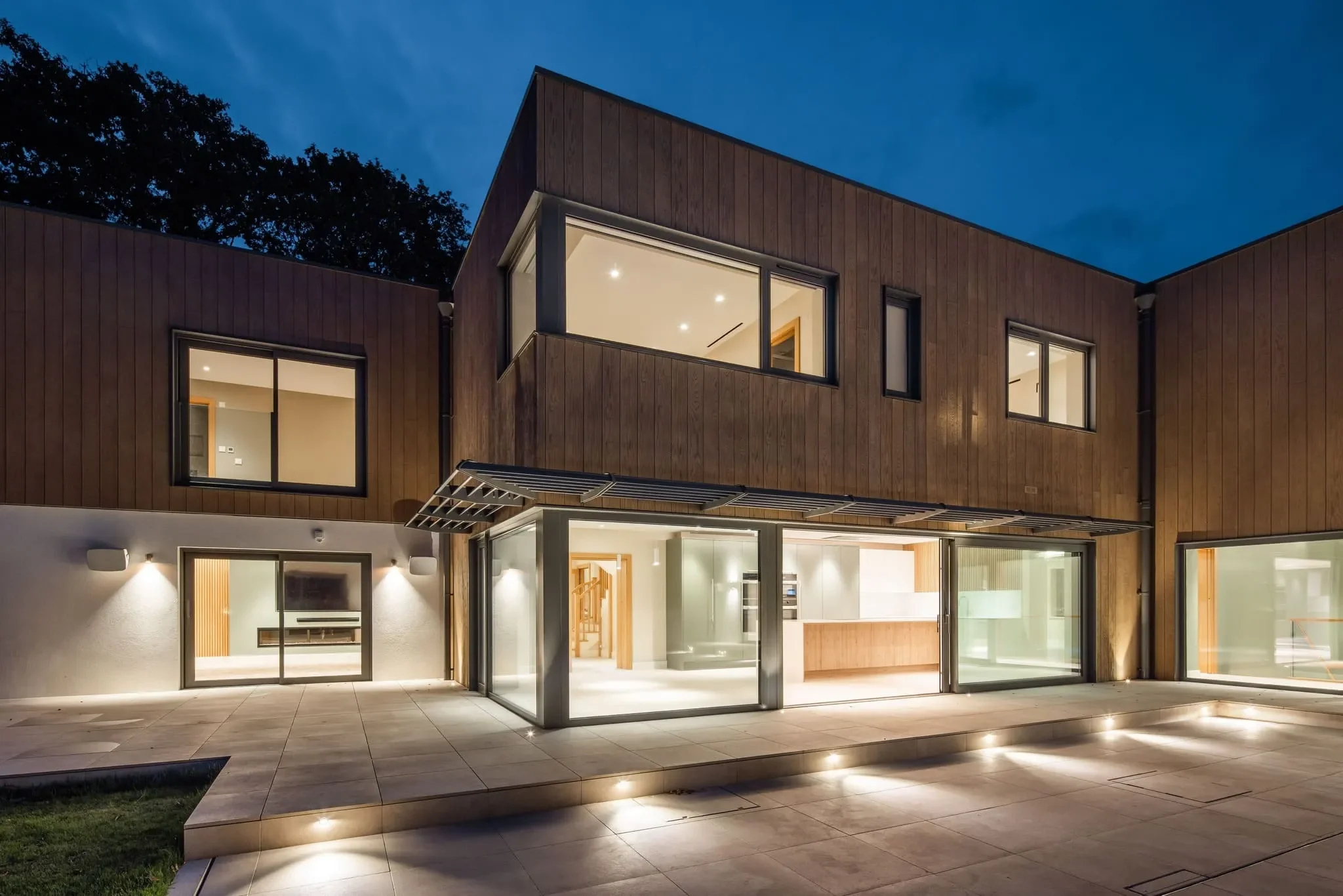 image of the outdoor courtyard at the jersey villa for sale on an evening