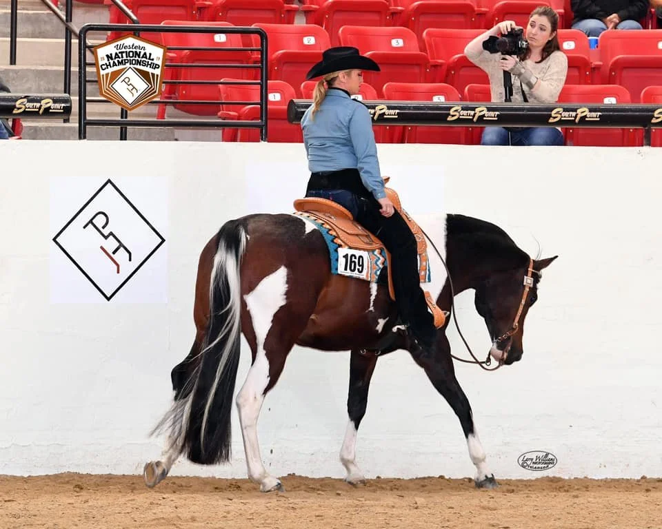 Tammie in action on her horse at a show horse event