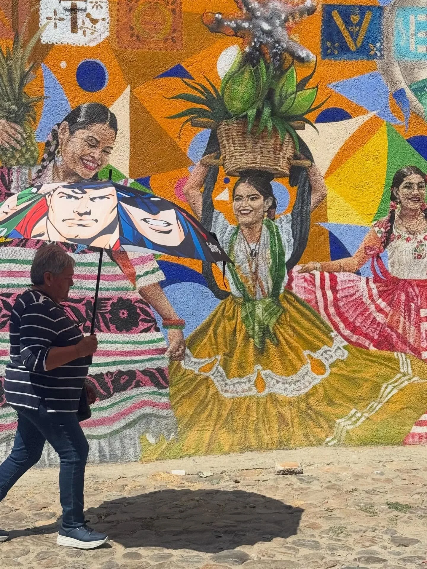 I didn&rsquo;t see the superheroes on her umbrella in the bright sun. I was starstruck by the mural and the larger than life dancers. Oaxaca is a place of duality: ancient / modern, indigenous / Spanish, good smells / bad smells, loud moments /quiet 