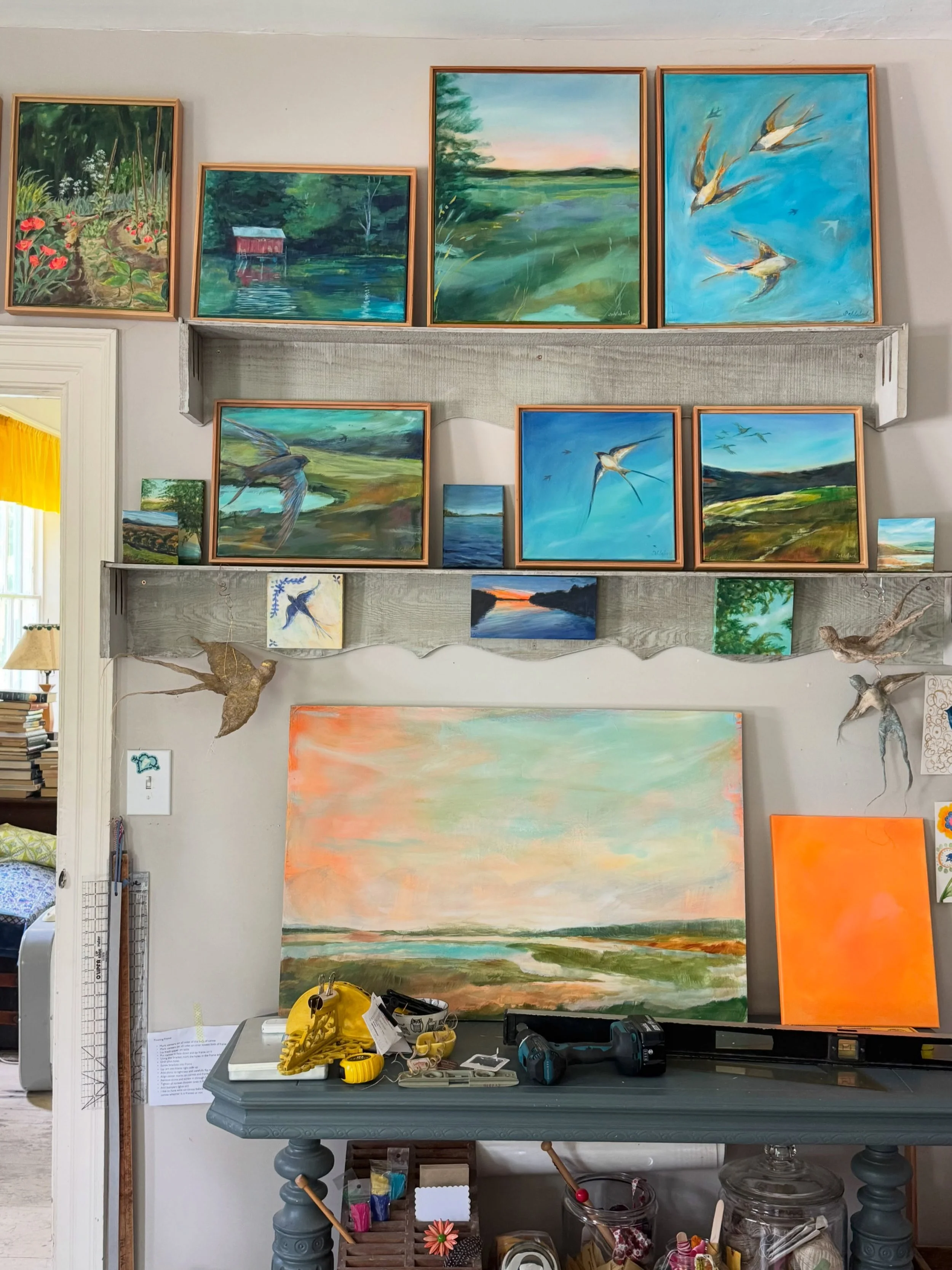 The shelves are level. The room is not.🤷&zwj;♀️ New studio gallery wall. I removed about 18 nails, patched the wall and then repurposed two curtain pelmets (found at @anjouvt). I turned them around to become shelves. No nails. Just lean the work in 