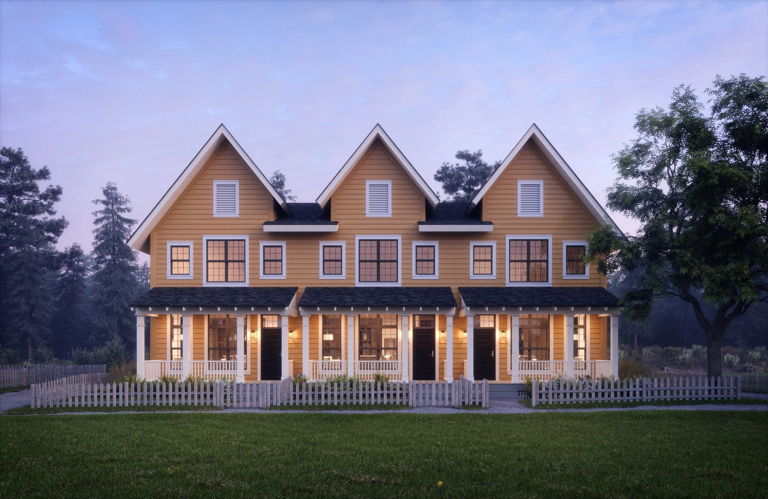 A yellow multi-family house with three sections, white trim, and black doors, illuminated by exterior lights, surrounded by a white picket fence and landscaped yard, with trees and a partly cloudy sky in the background.