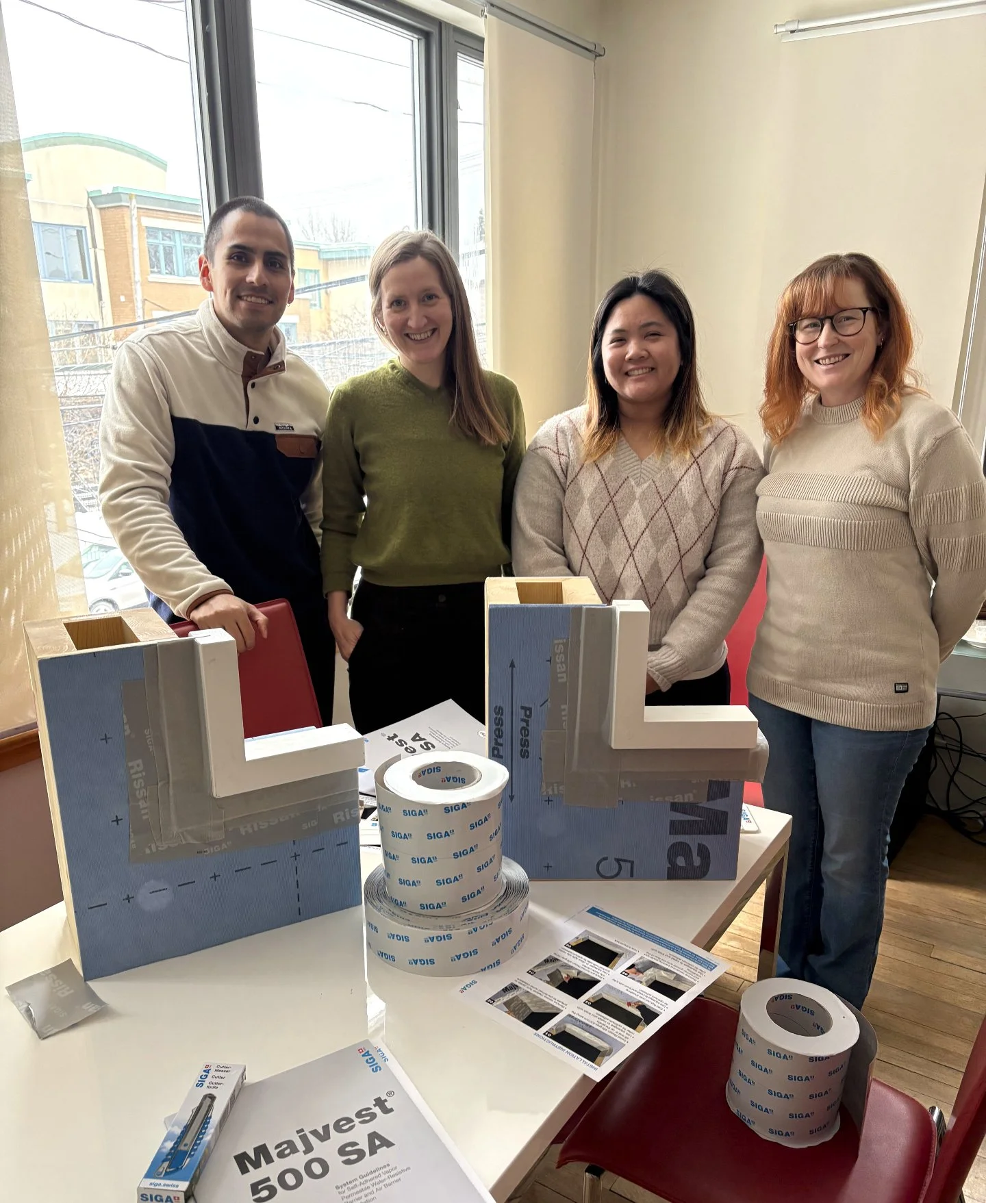 We had fun with a truly hands-on lunch and learn this week, creating waterproof window section mockups with SIGA membranes. 
Proper detailing of the products you don't see once all the pretty finishes go up is so important.  It makes all the differen