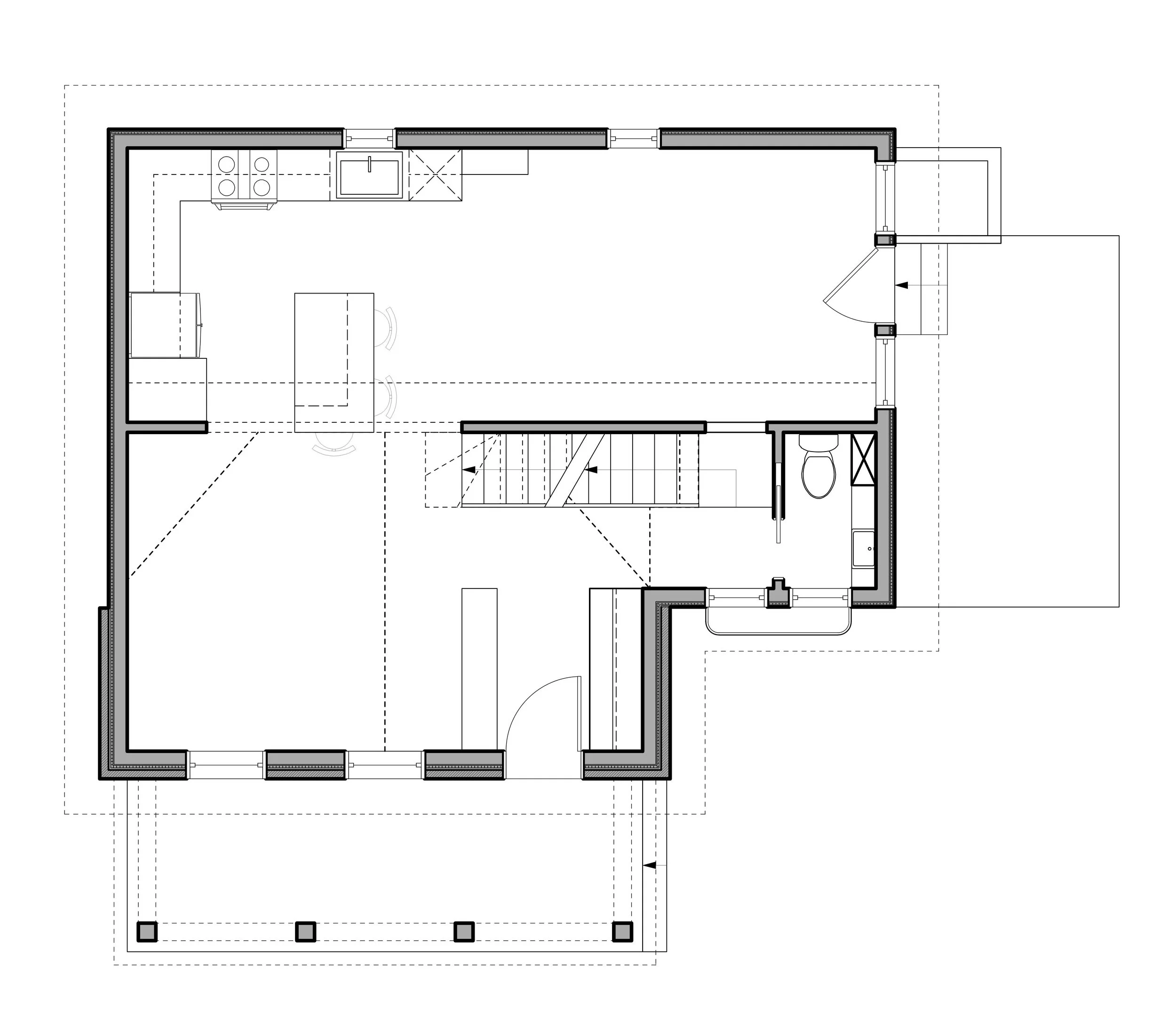 Floor plan of a house with a kitchen, dining area, living space, bathroom, and staircase.
