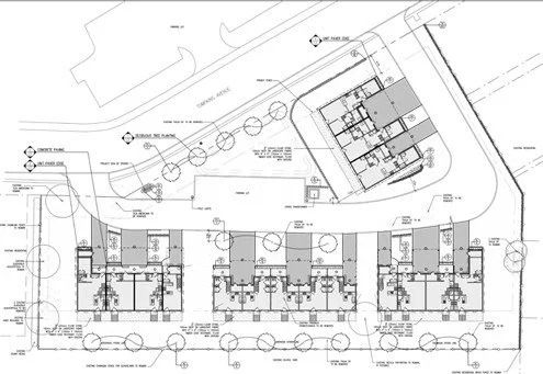 Architectural site plan of a residential development with multiple buildings, trees, walkways, and parking areas.