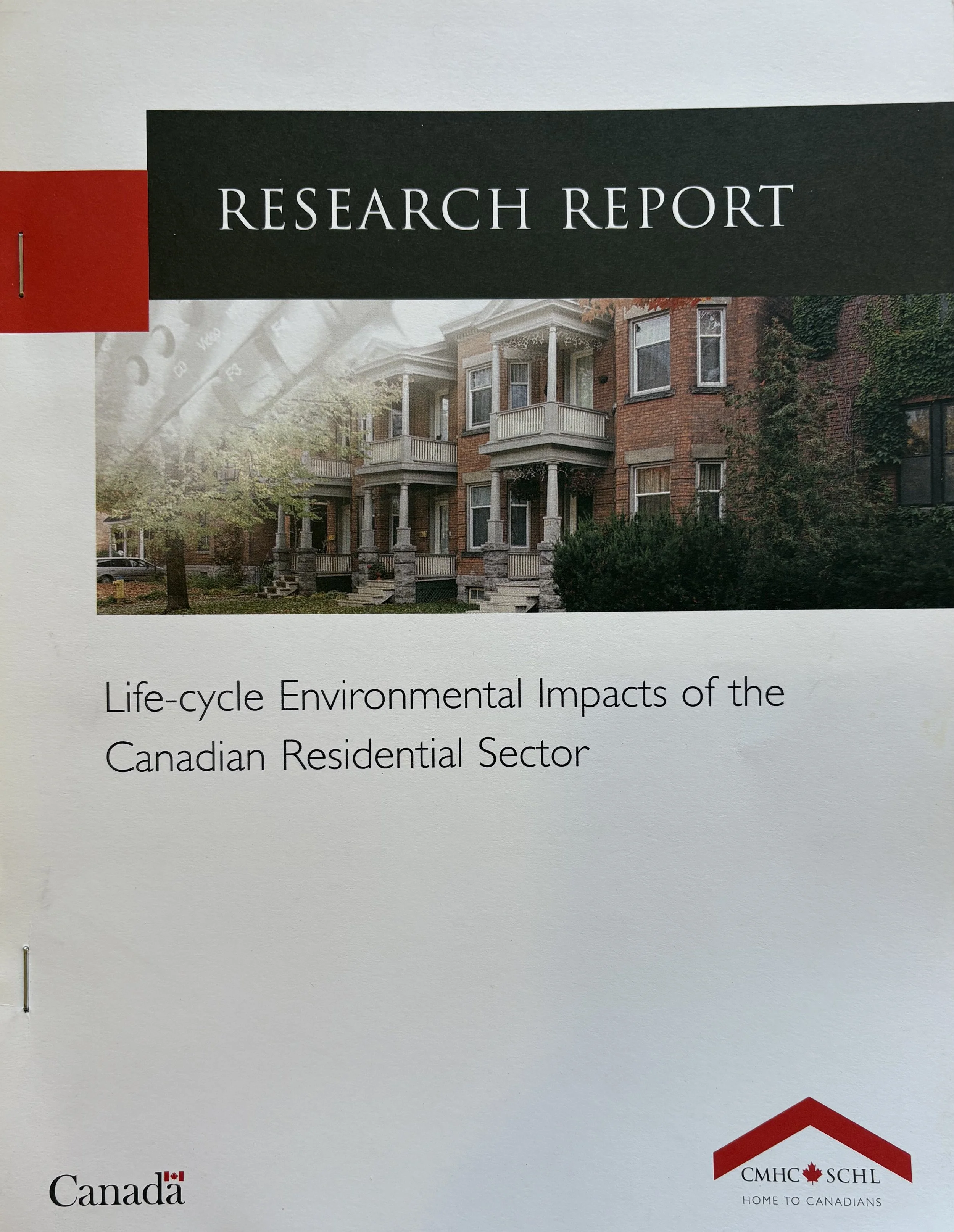 CMHC Research report cover with a photo of a row of Victorian brick homes, titled "Life-cycle Environmental Impacts of the Canadian Residential Sector".
