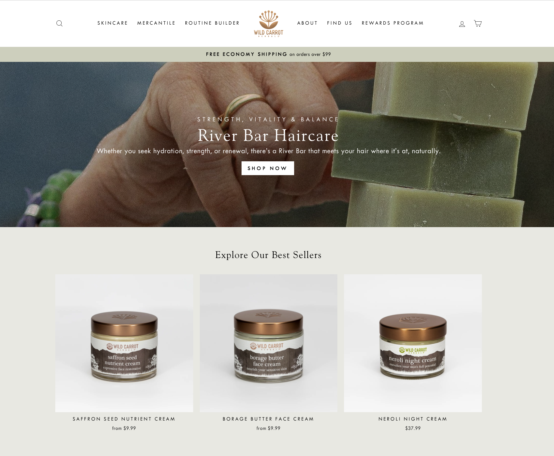 Website promoting Wild Carrot face creams, showing a hand holding green soap bars at the top and three face cream products labeled Saffron Seed Nutrient Cream, Borage Butter Face Cream, and Neroli Night Cream below with prices.