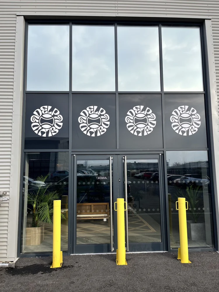 Commercial building entrance with tinted glass doors
