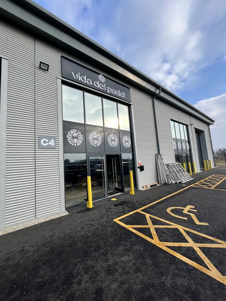 Commercial building exterior with tinted glass frontage