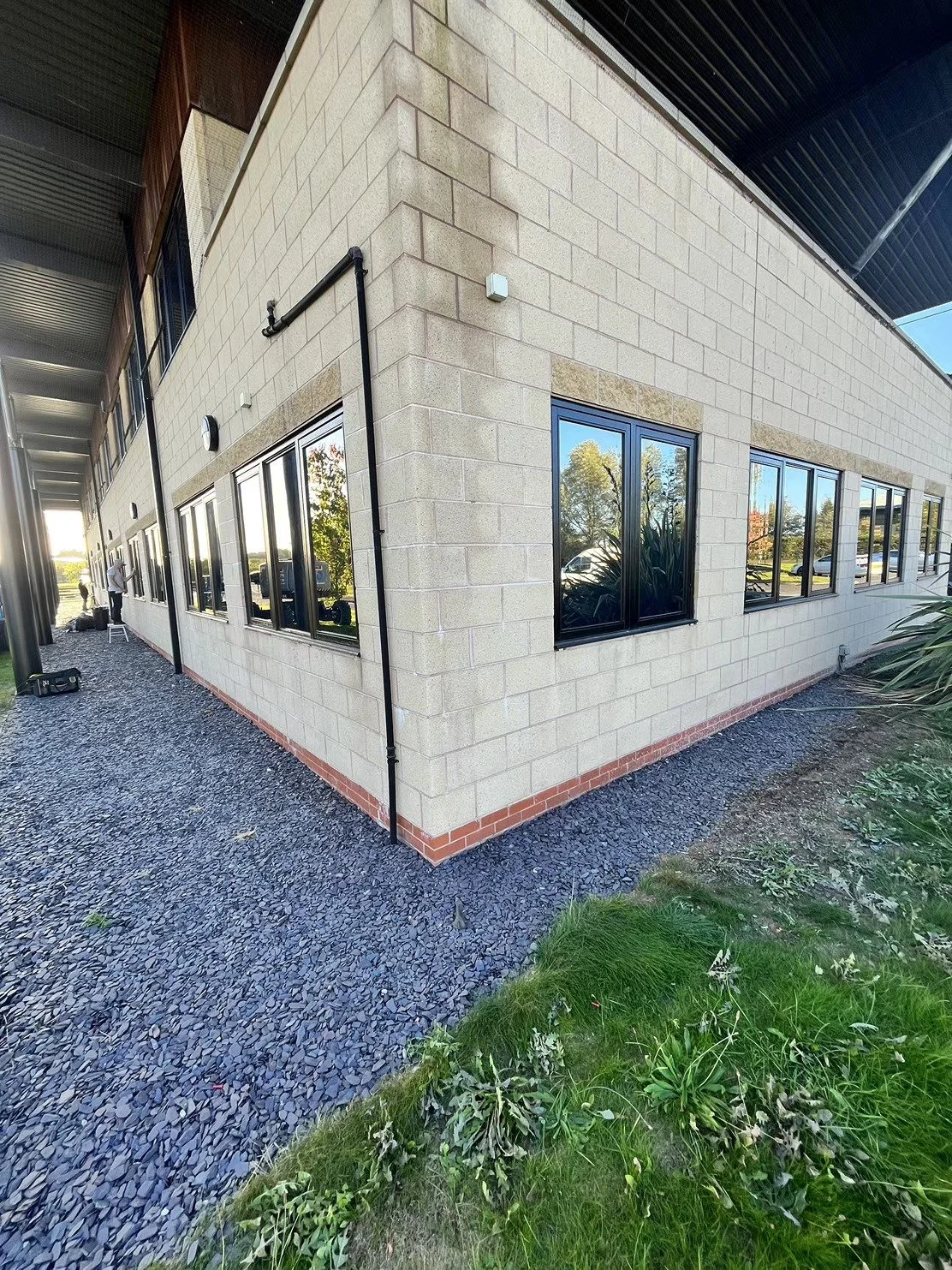 Corner of a modern commercial building with tinted windows