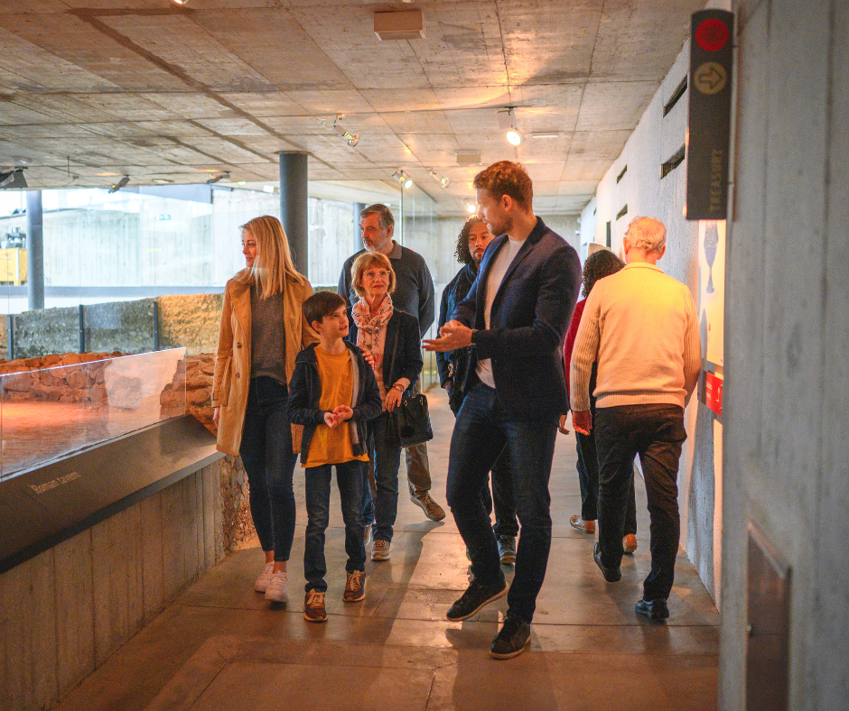 A family enjoying a trip to a museum together. 
