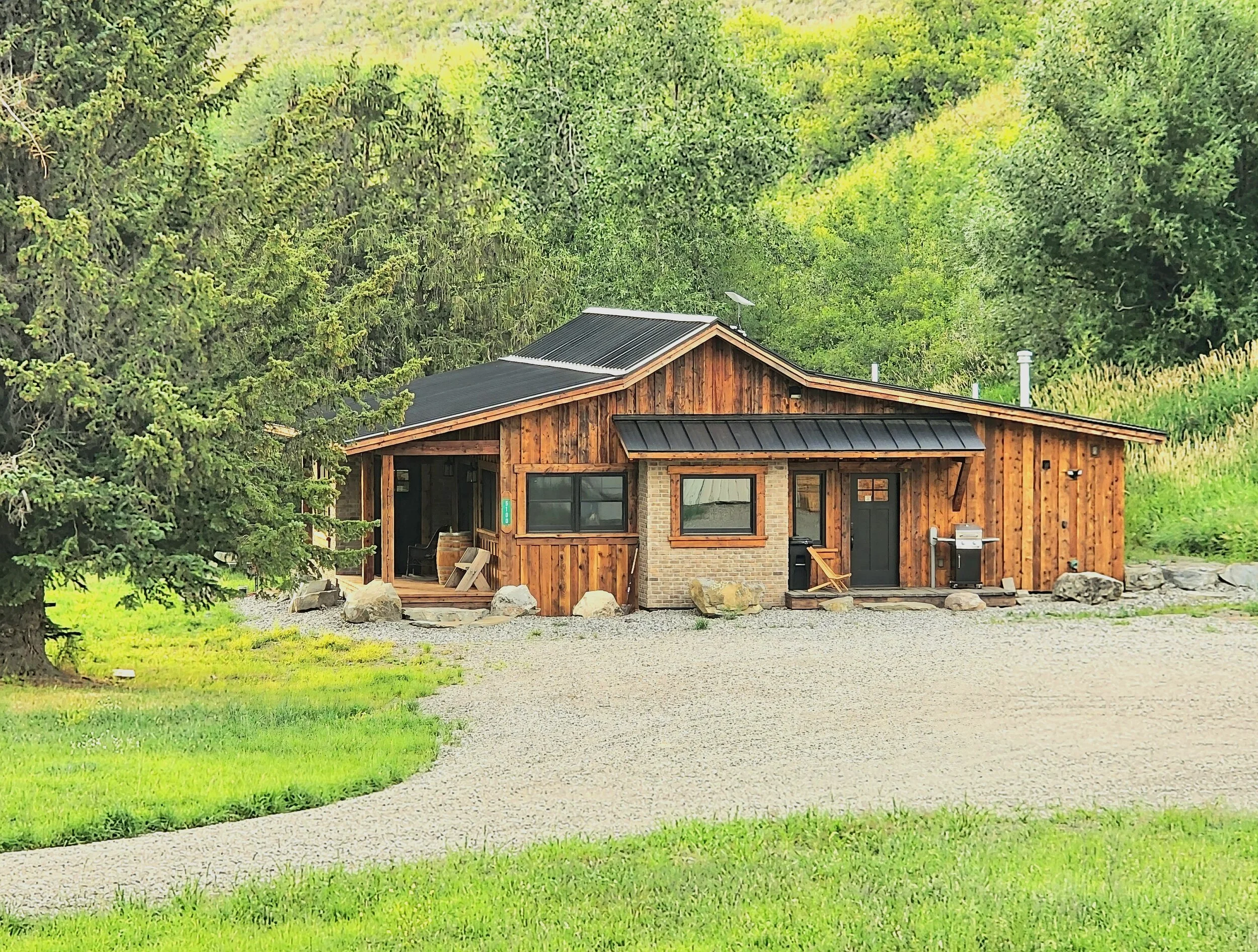 Farmhouse lodge in lush green grass